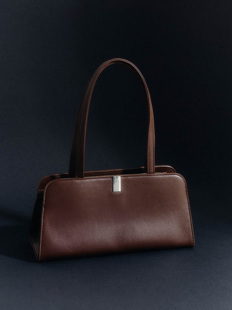 Trapezoid-shaped bag in matte eco-leather with silver accents