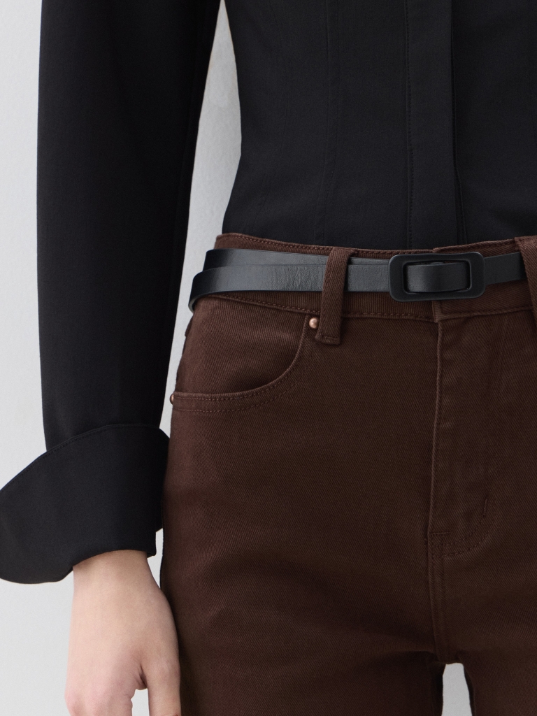 Thin eco-leather belt with a matching buckle