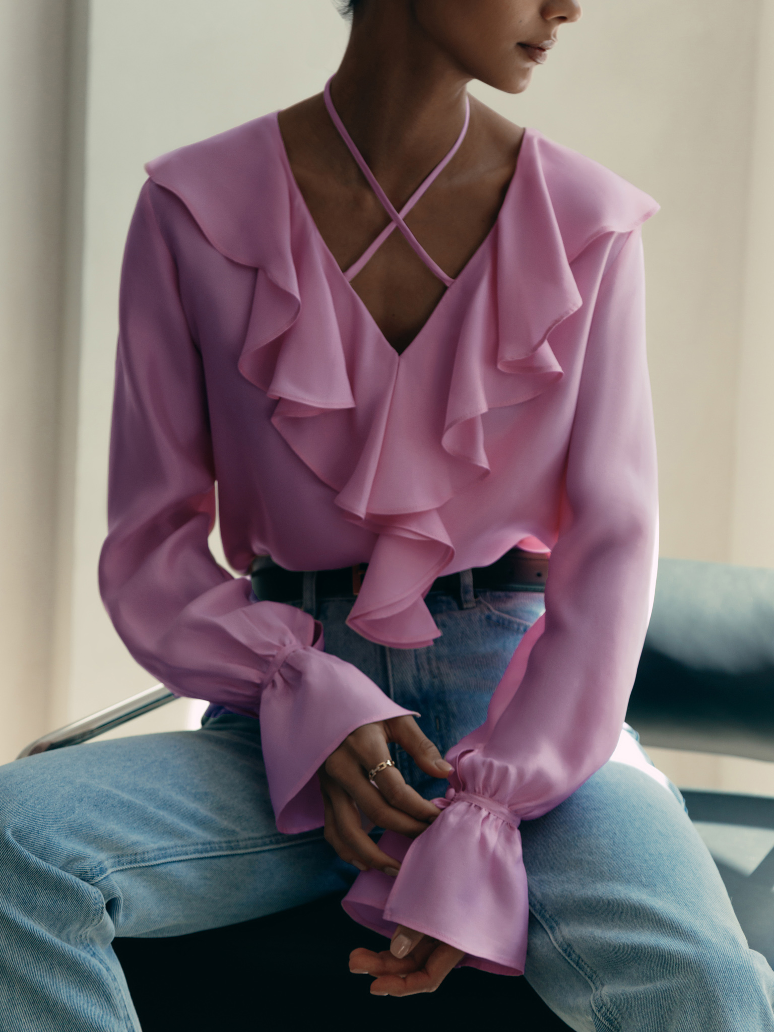 Lightweight blouse with ruffles and tie-up at the collar