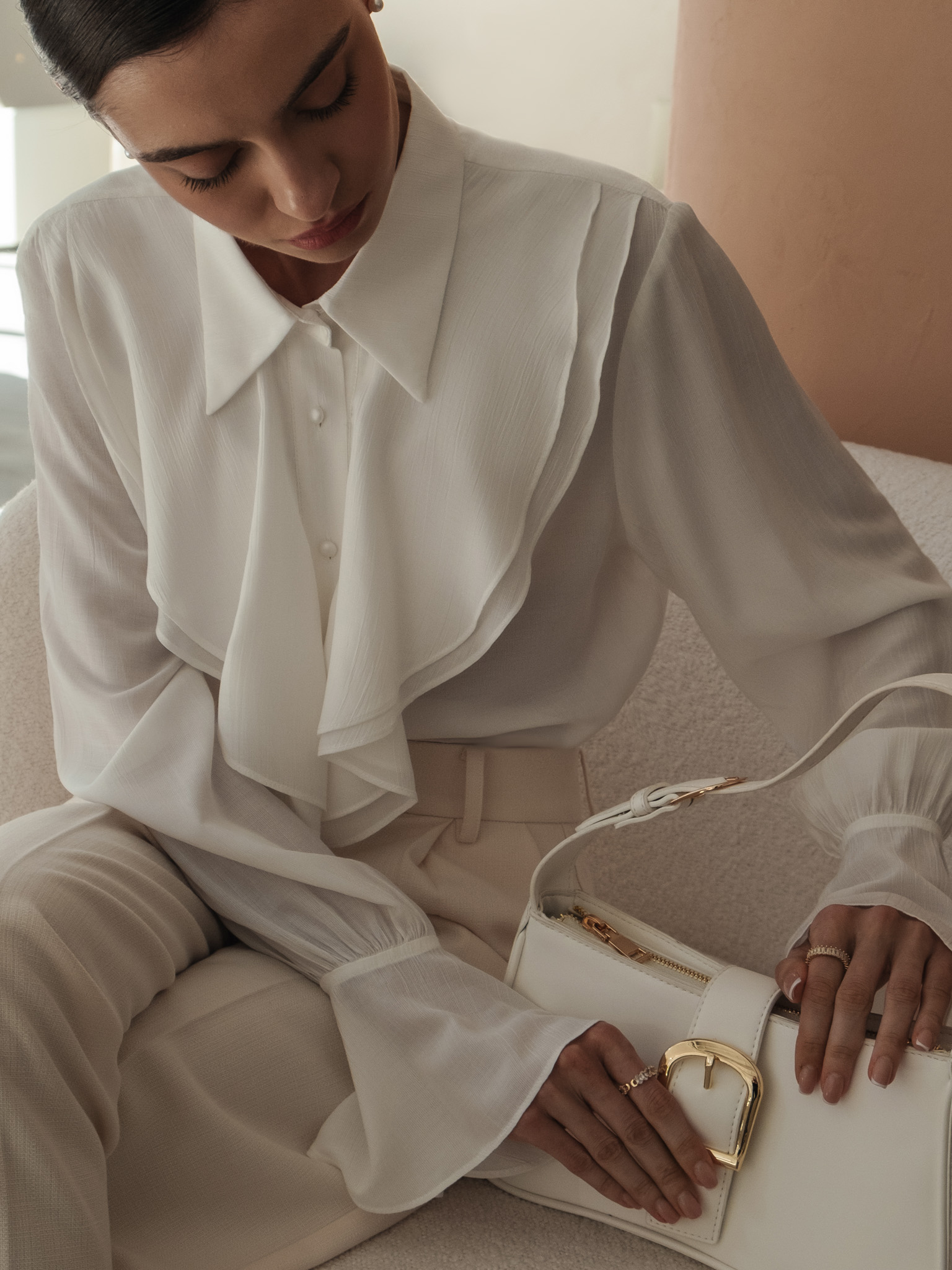 Blouse with voluminous flounces and button fastening