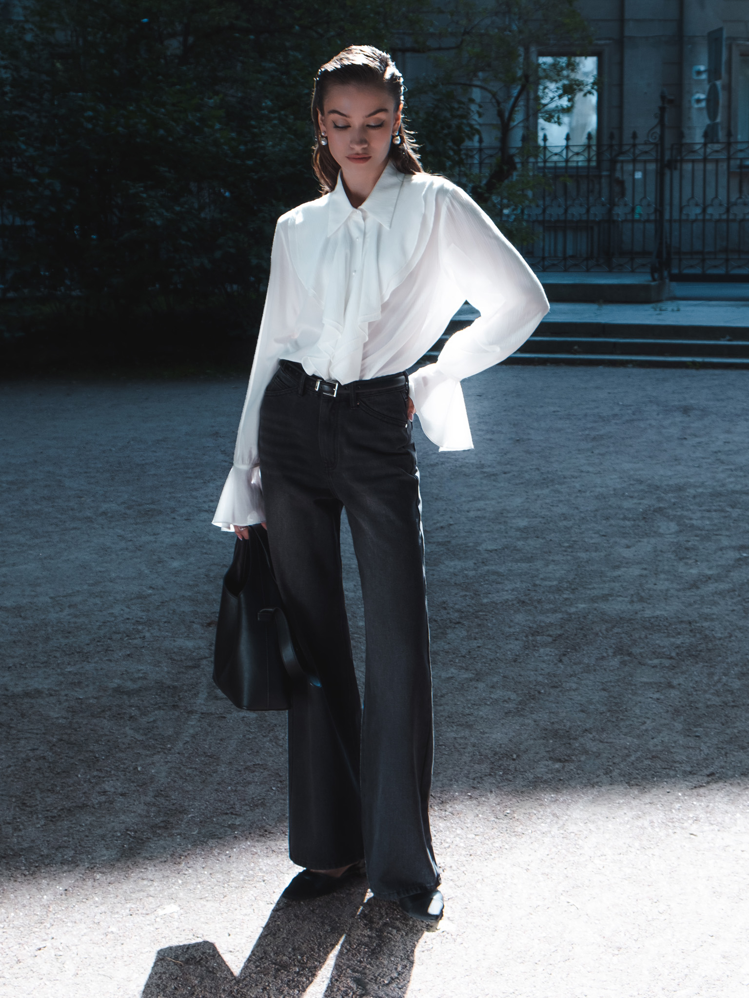 Blouse with voluminous flounces and button fastening