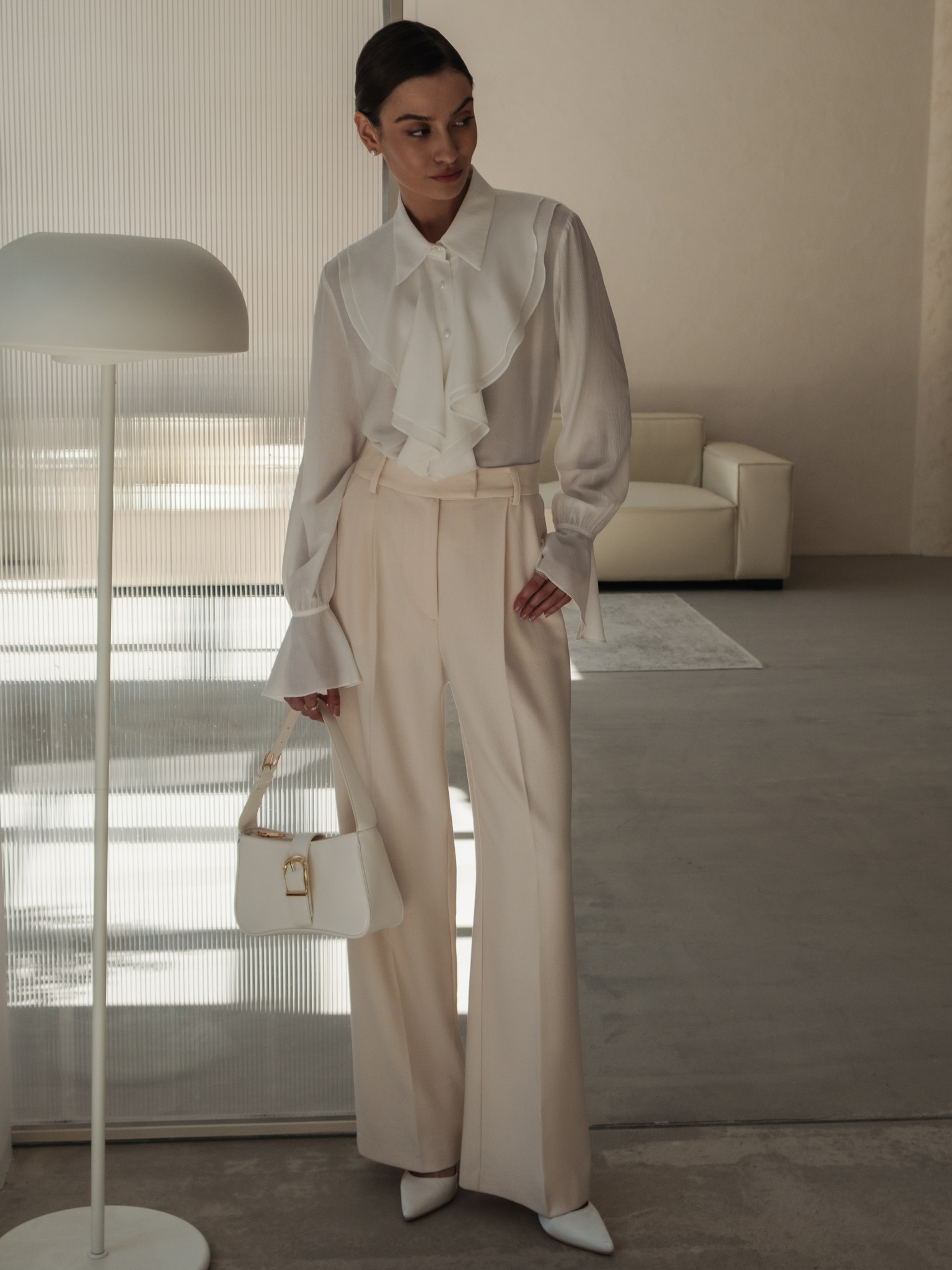 Blouse with voluminous flounces and button fastening