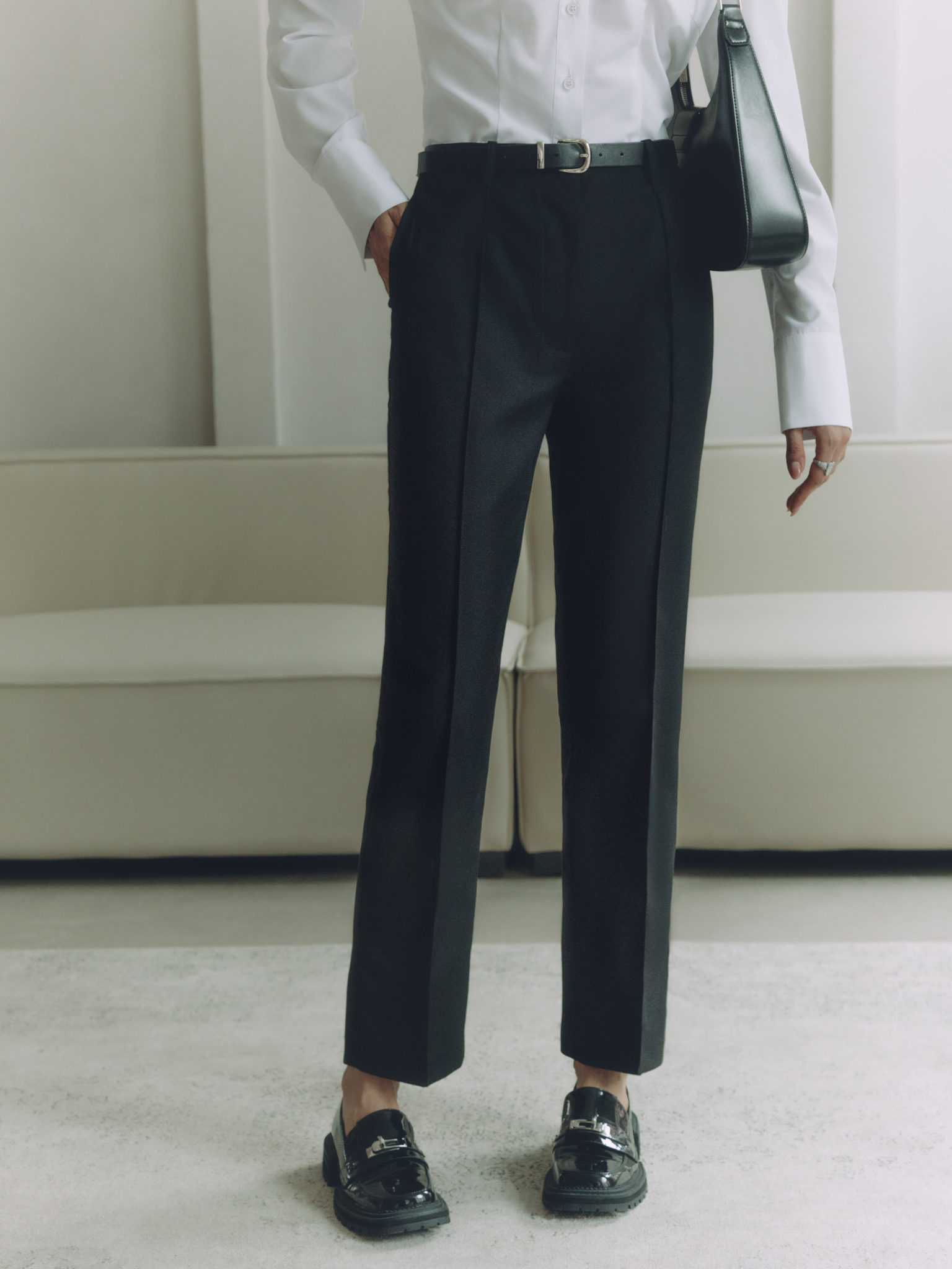 Cropped trousers with a crease and eco-leather belt