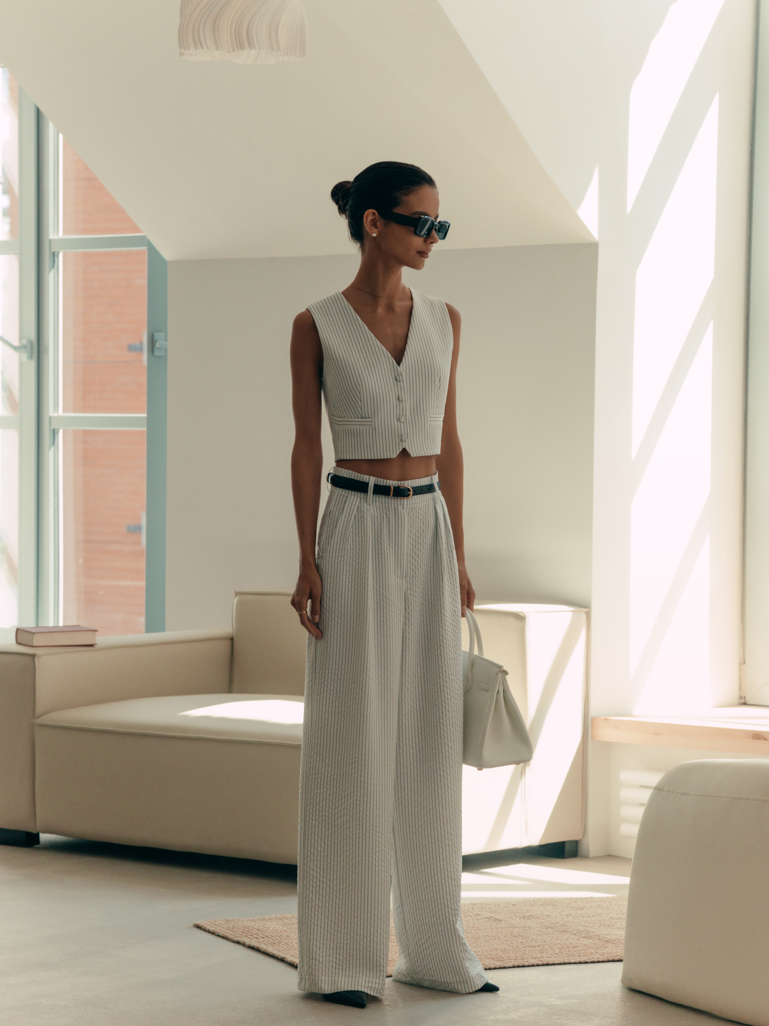 Thin-striped trousers with waist pleats