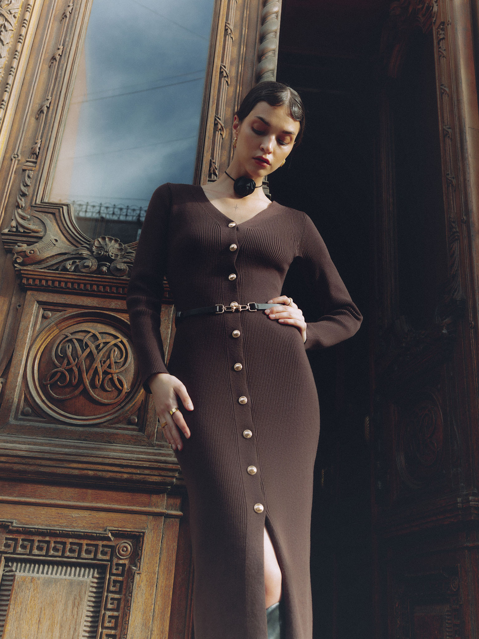 Knitted midi dress with a belt and golden decorations