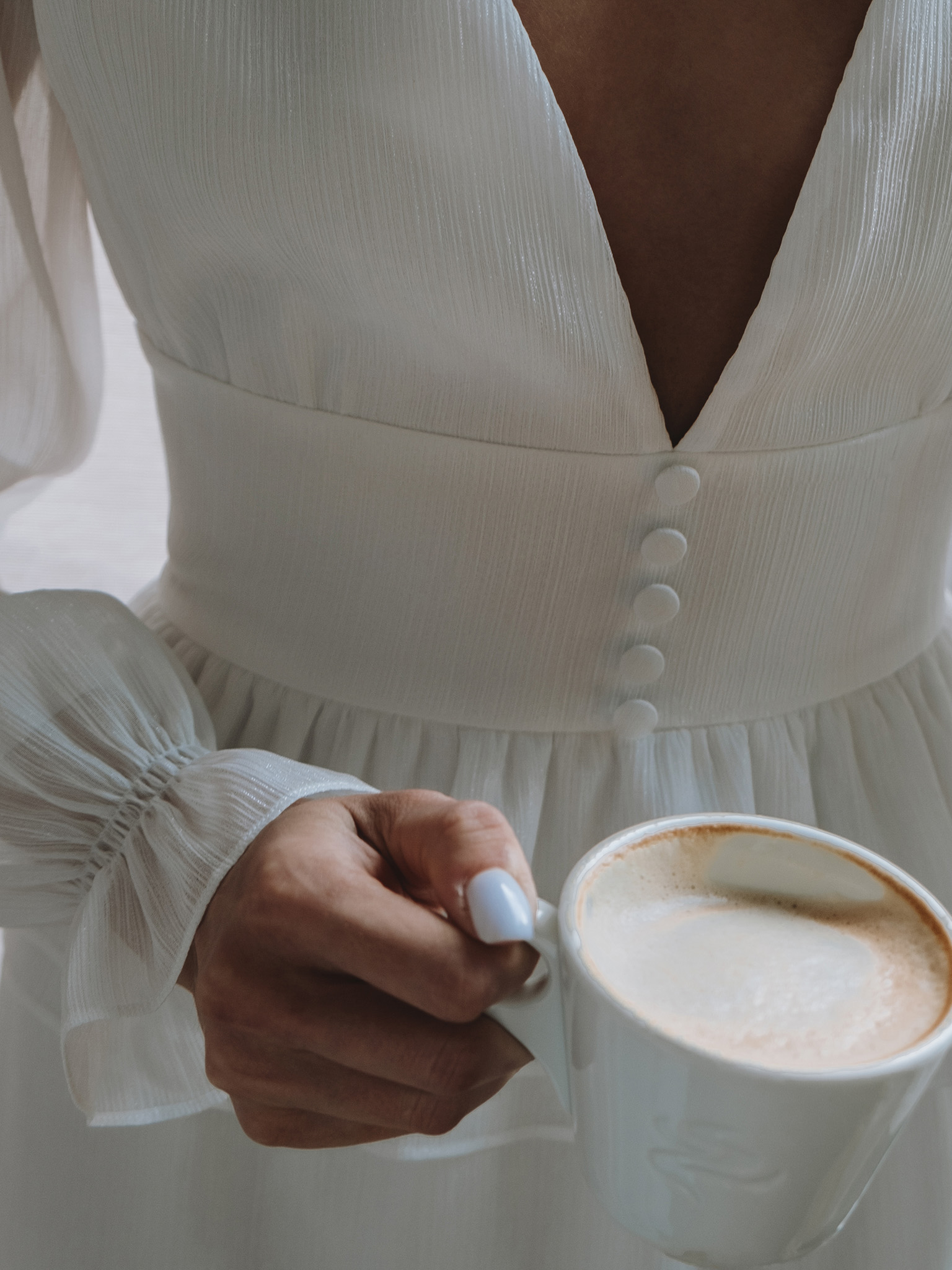 V-neck mini dress with decorative buttons