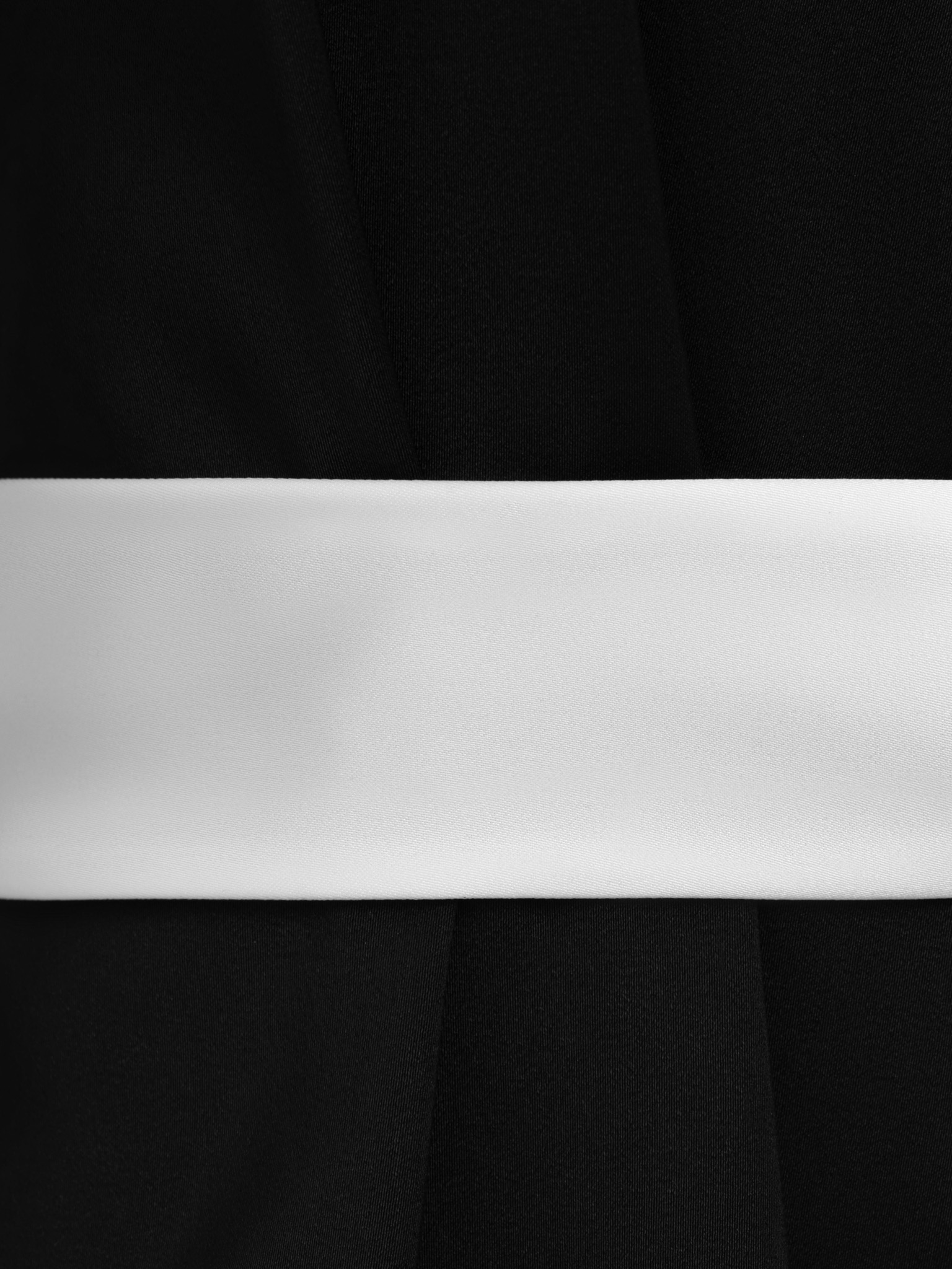 Maxi dress with contrasting inserts and flower brooch