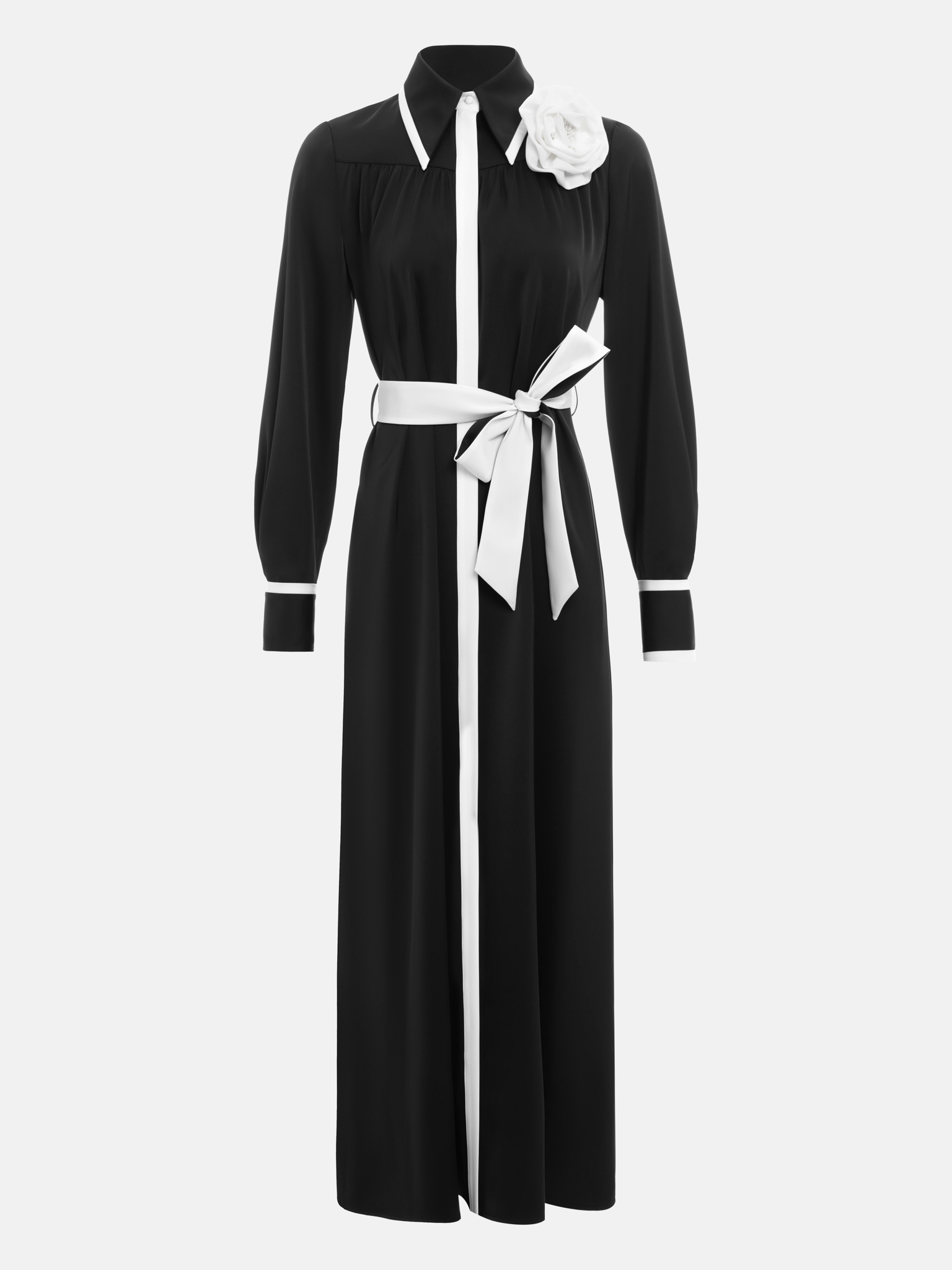 Maxi dress with contrasting inserts and flower brooch