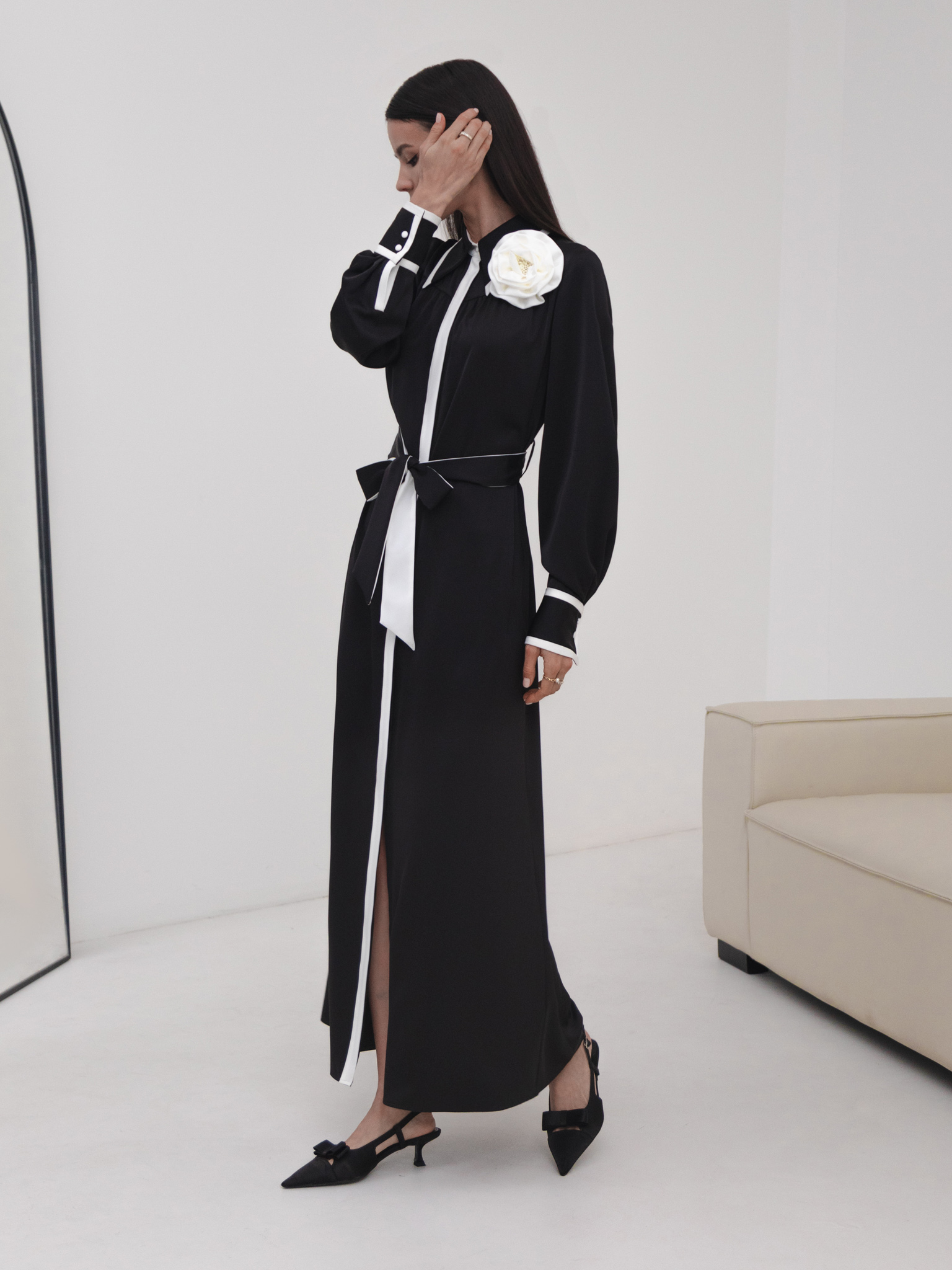 Maxi dress with contrasting inserts and flower brooch