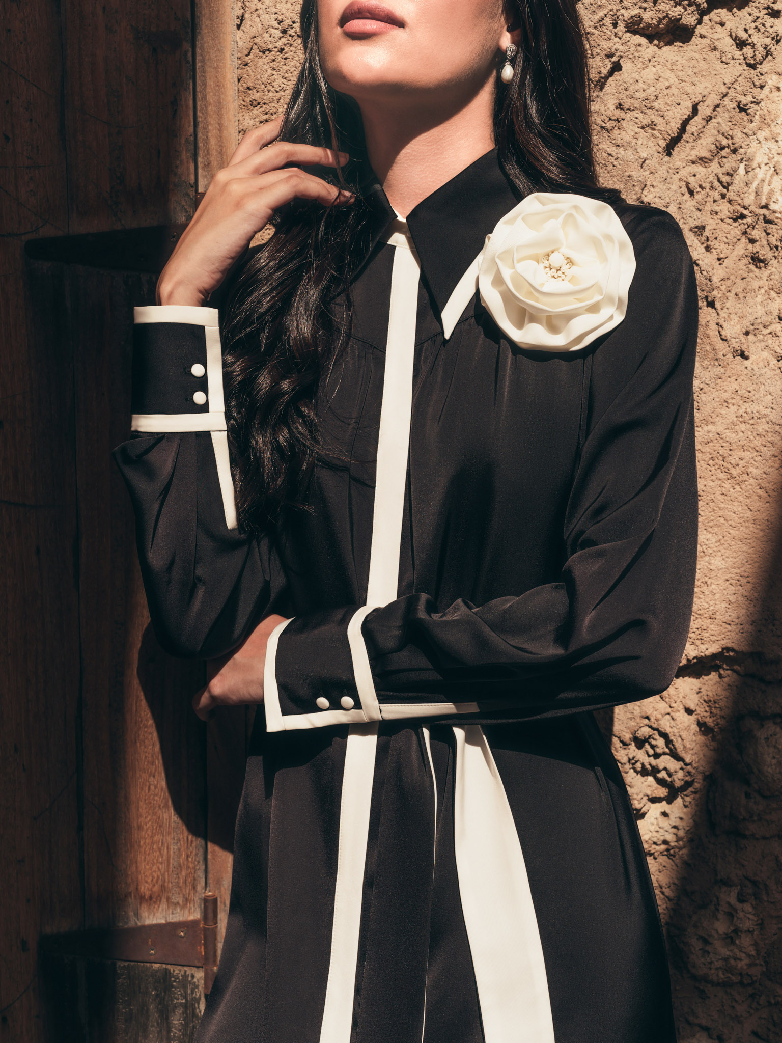 Maxi dress with contrasting inserts and flower brooch