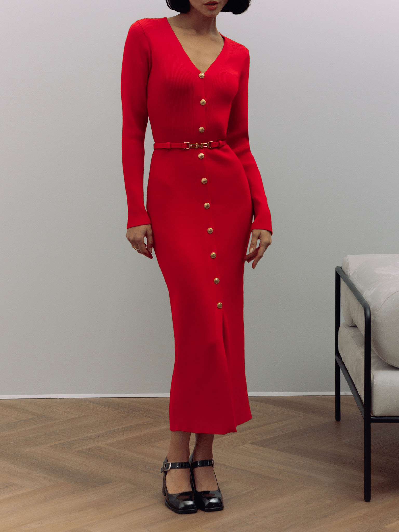 Knitted midi dress with a belt and golden decorations