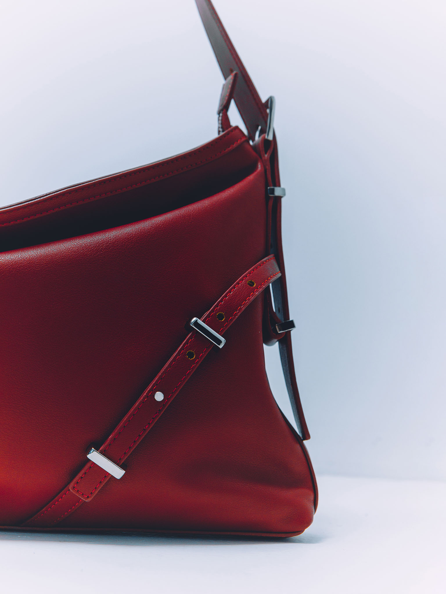 Rectangular eco-leather bag with metal decor