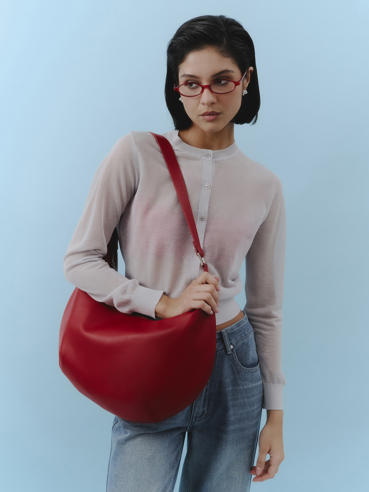 Semi-circular eco-leather bag with wide strap