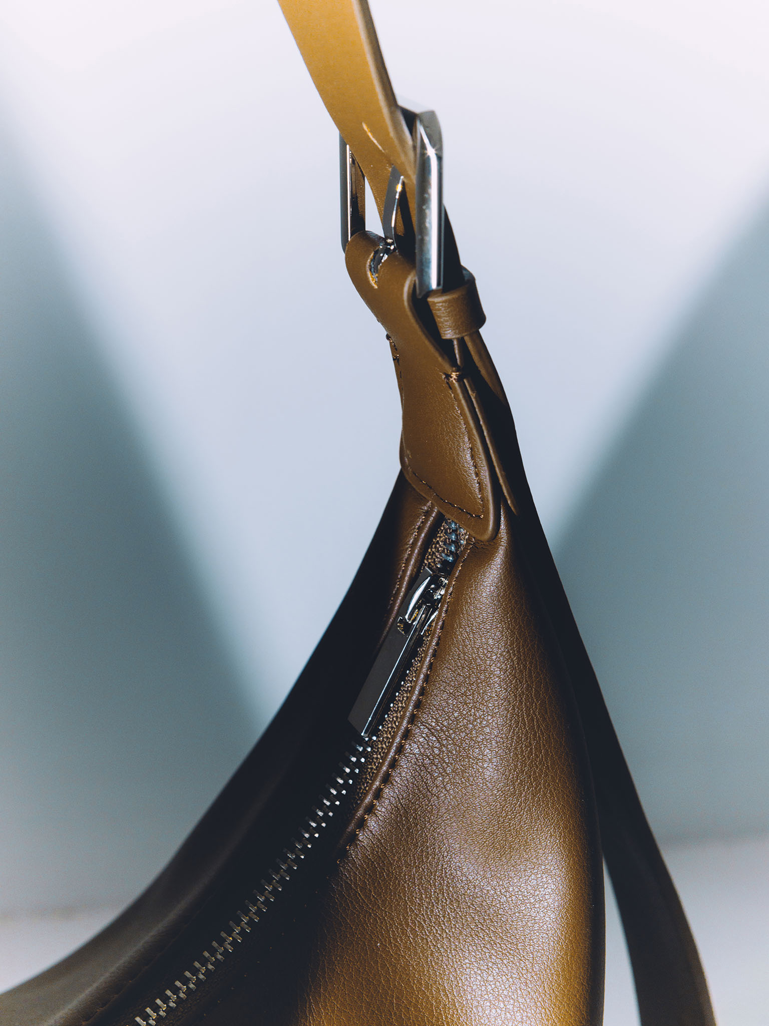 Semi-circular eco-leather bag with wide strap
