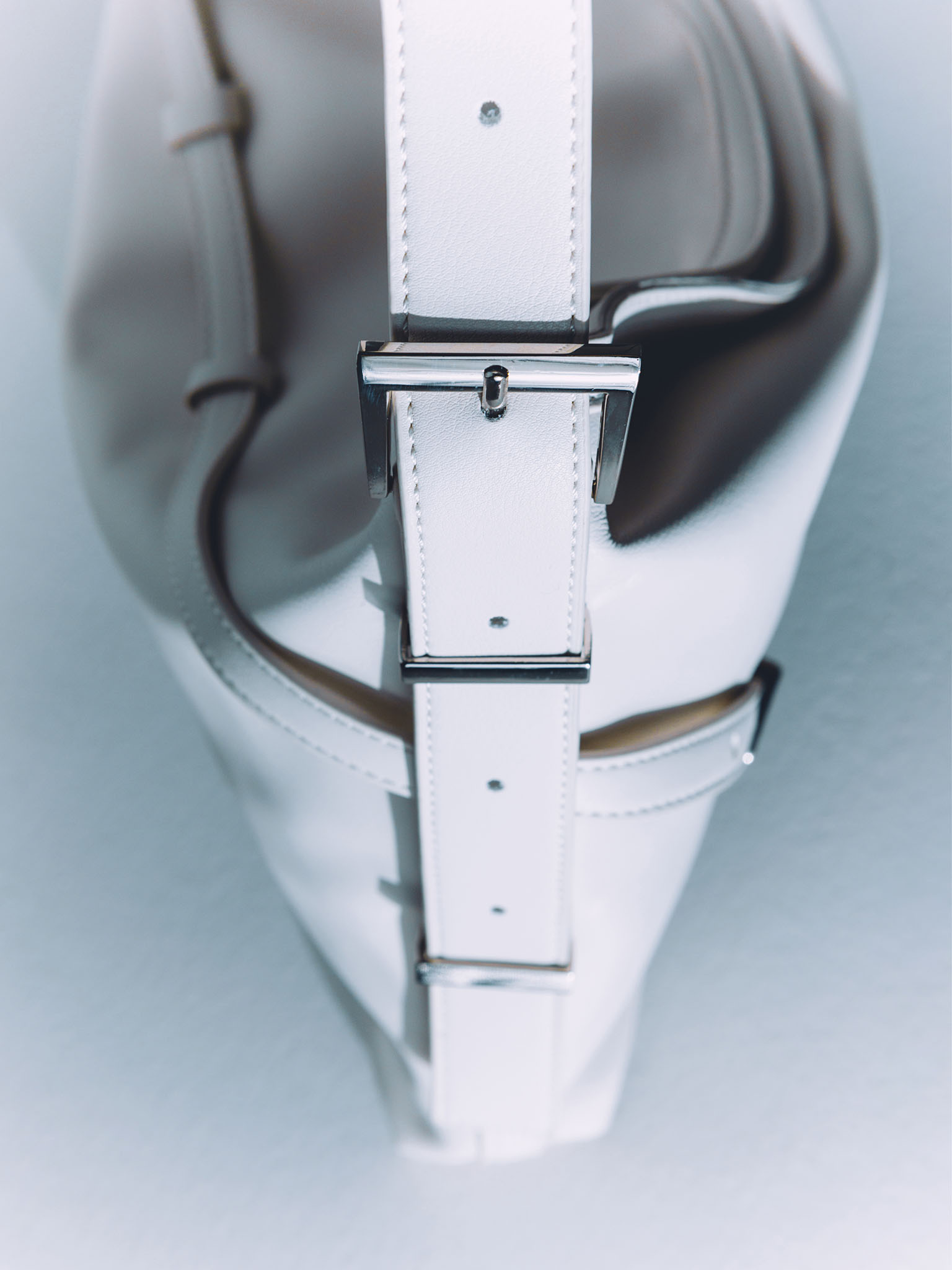 Rectangular eco-leather bag with metal decor