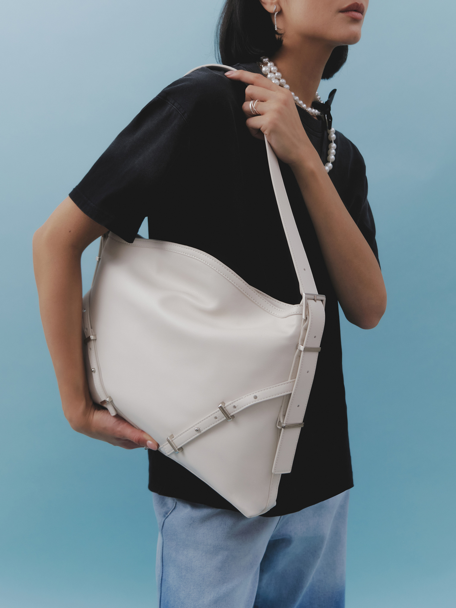 Rectangular eco-leather bag with metal decor