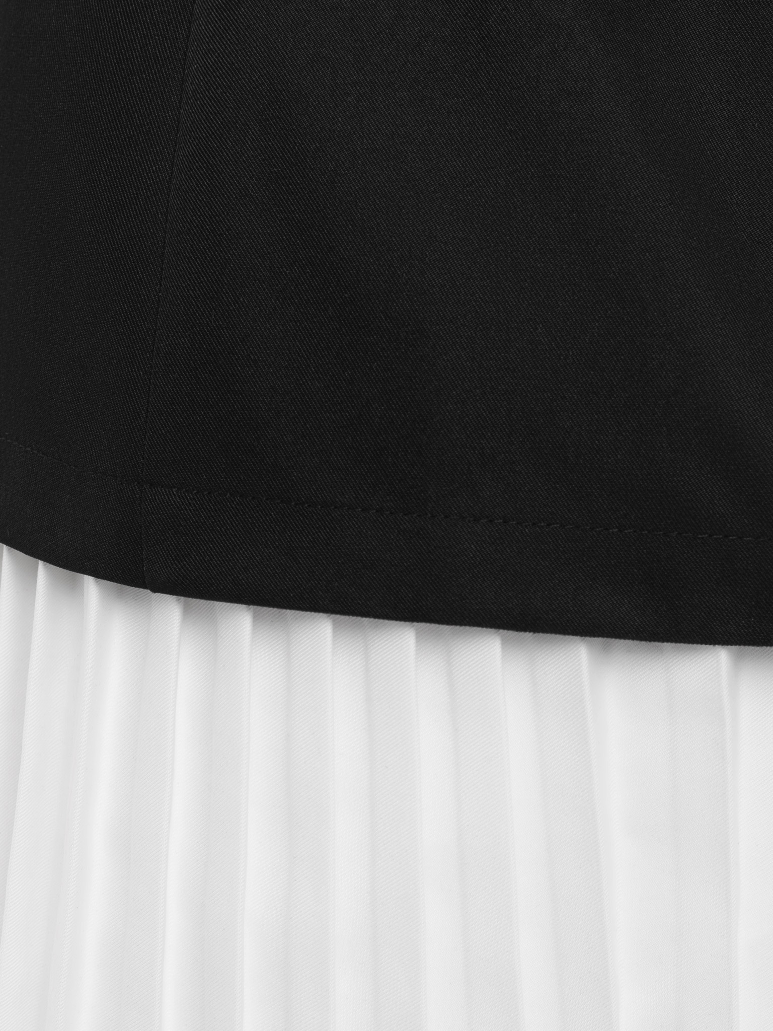 Fitted mini dress with pleated skirt