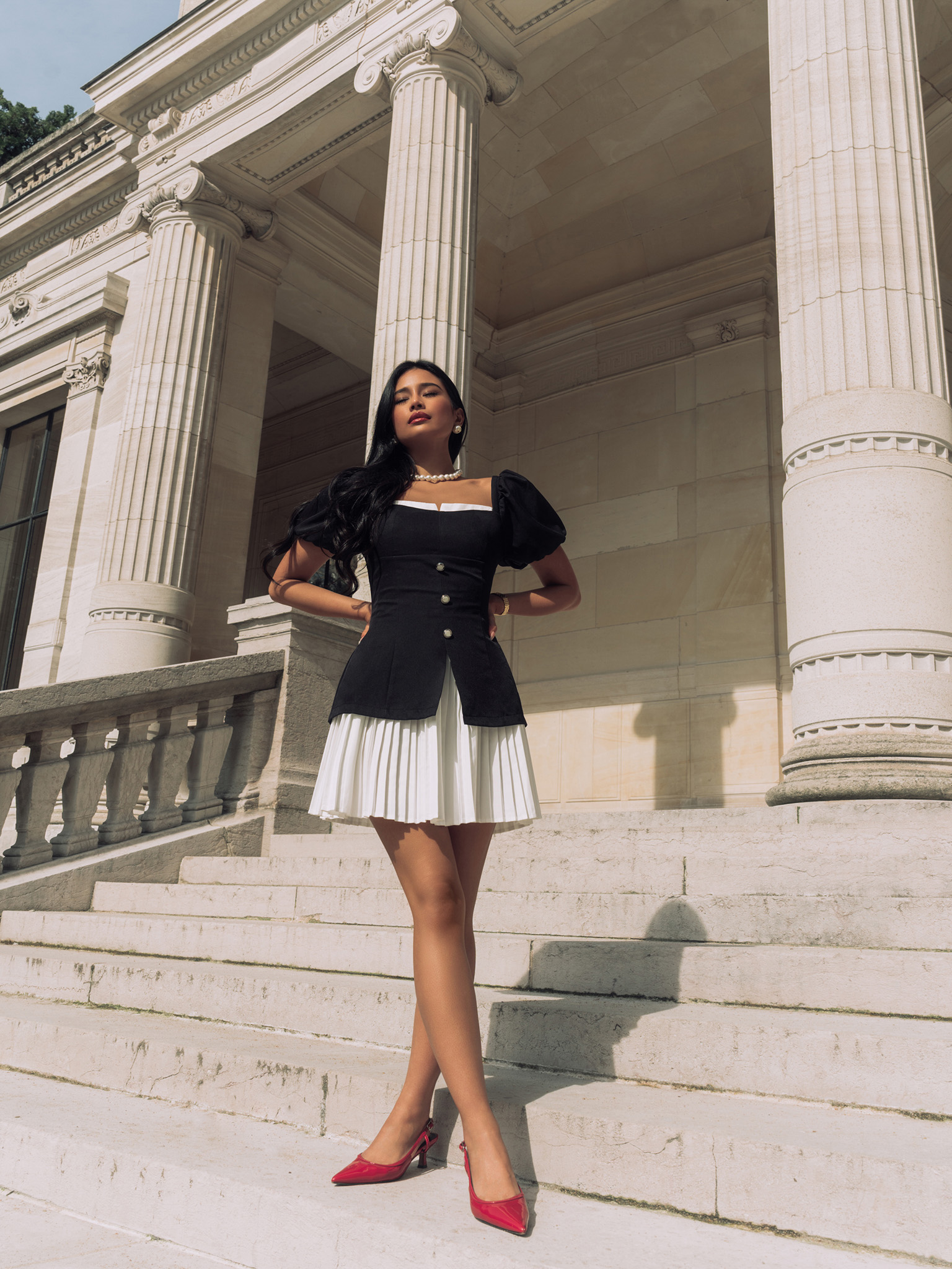 Fitted mini dress with pleated skirt