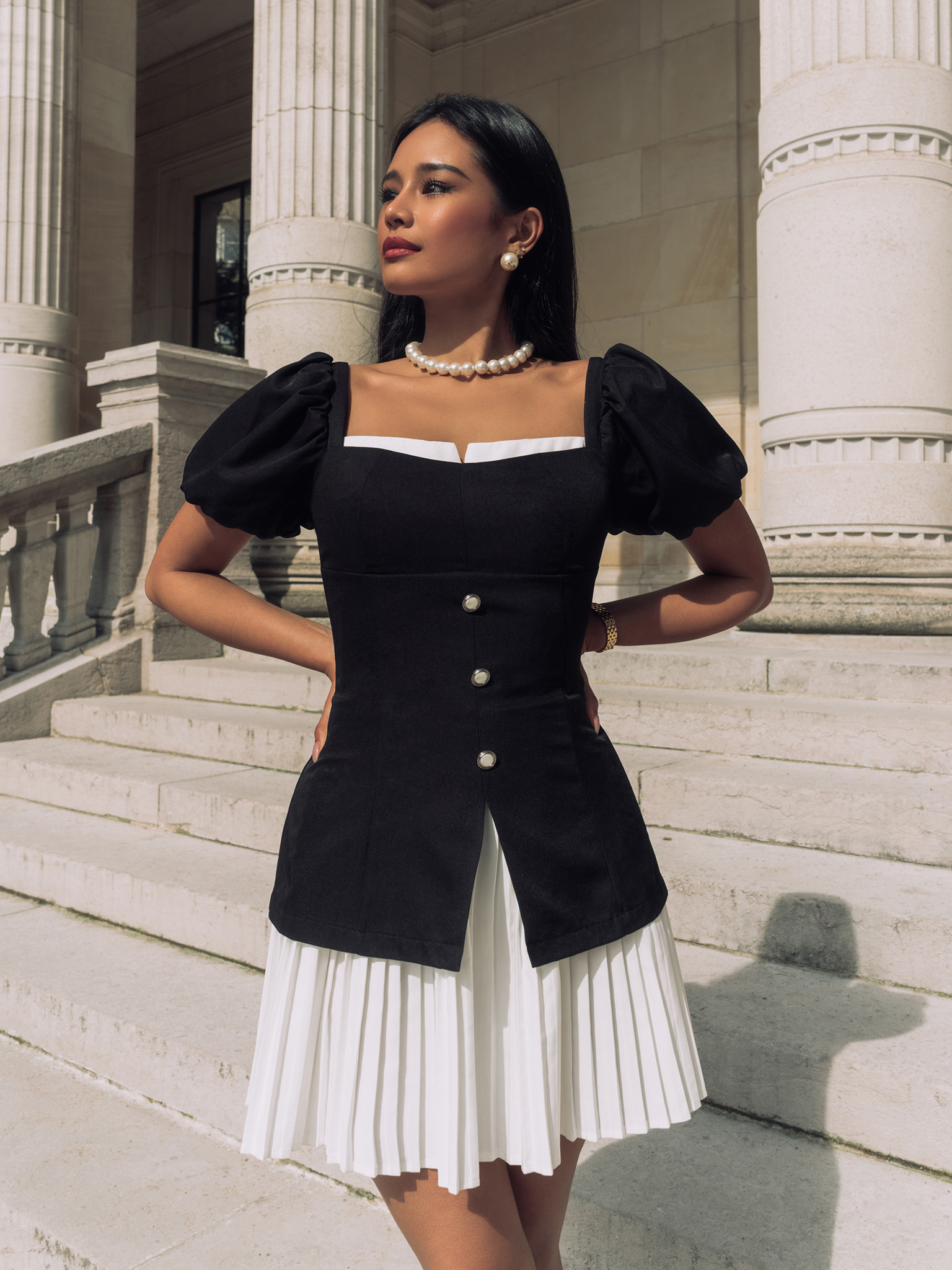 Fitted mini dress with pleated skirt