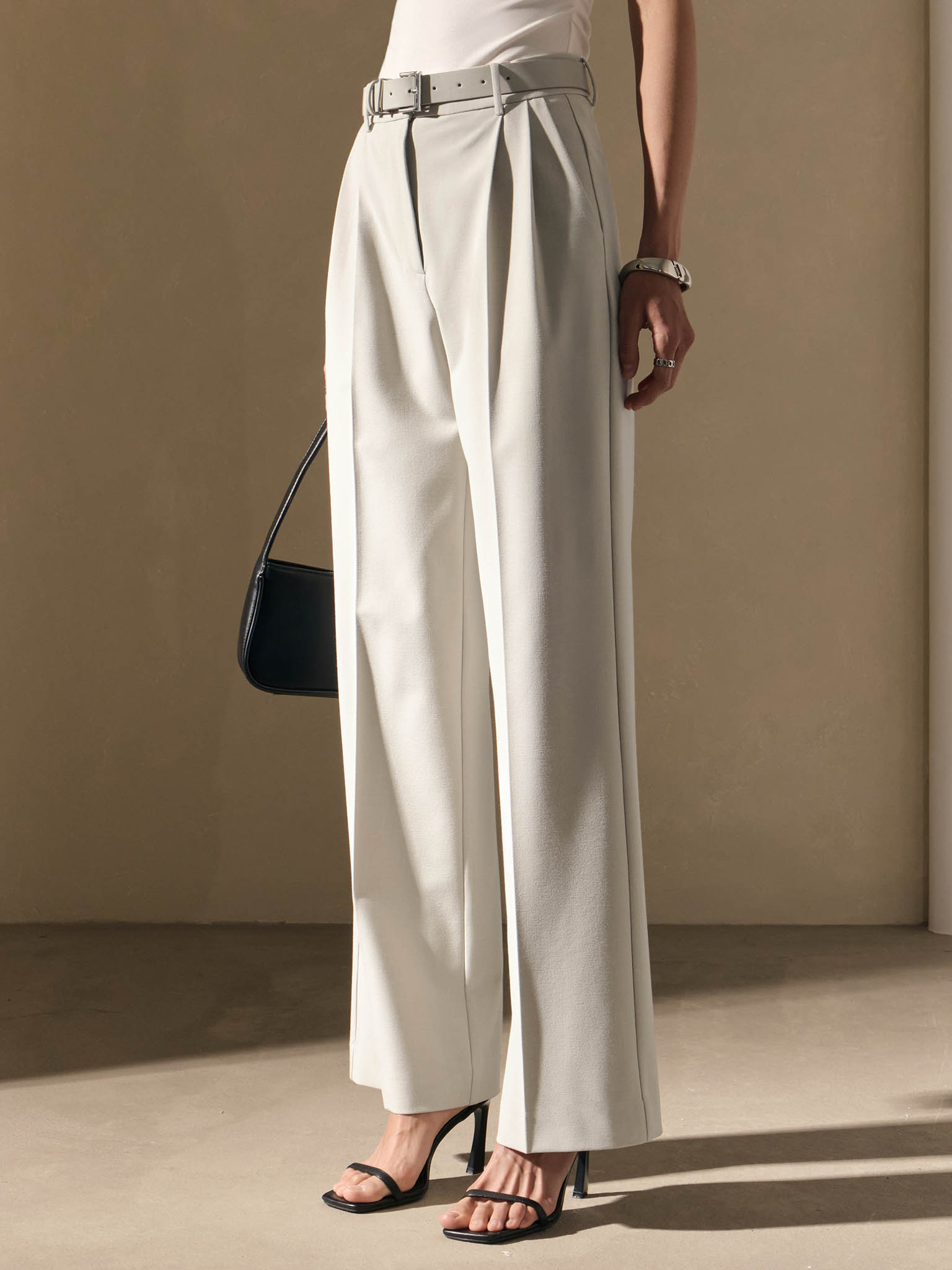 Trousers with a wide eco-leather belt