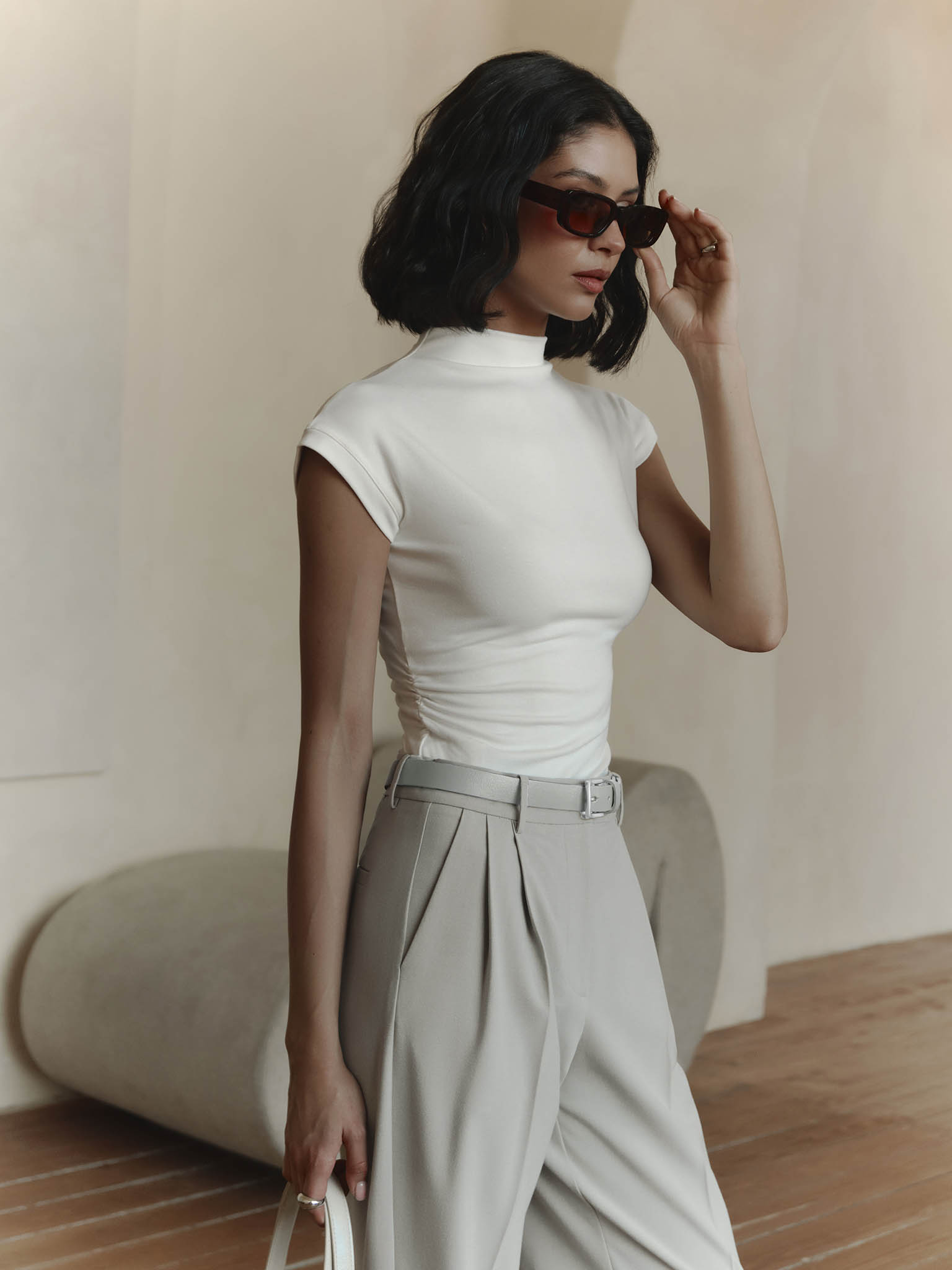 Sleeveless jersey top with stand-up collar