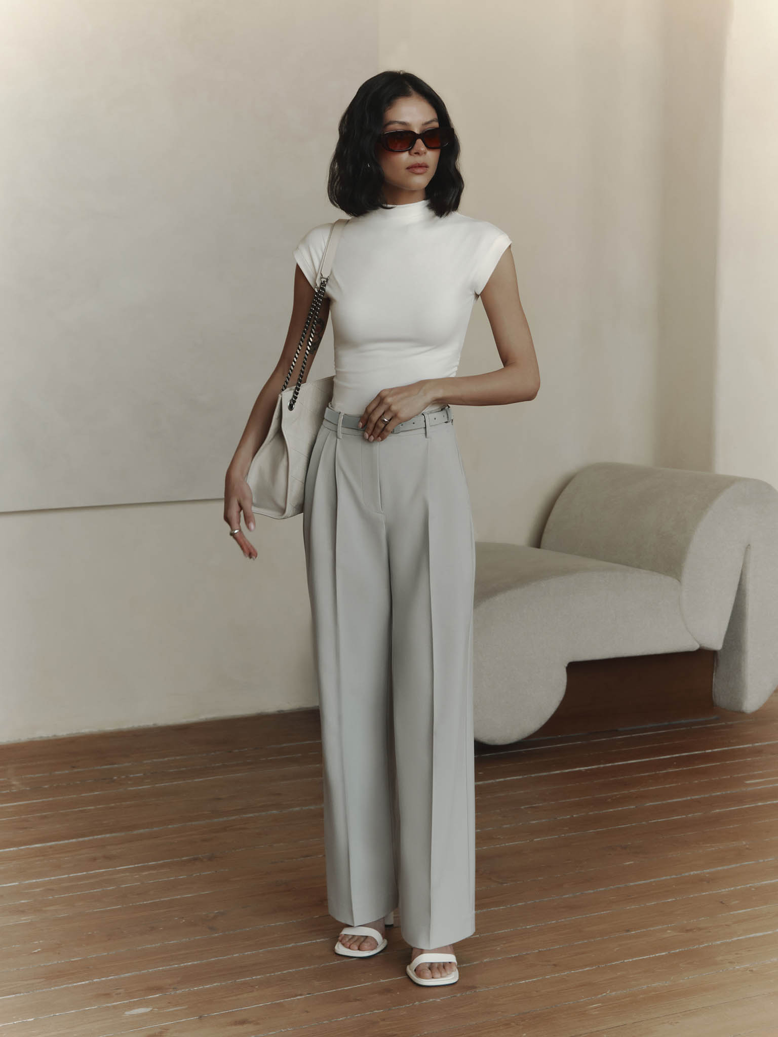 Sleeveless jersey top with stand-up collar