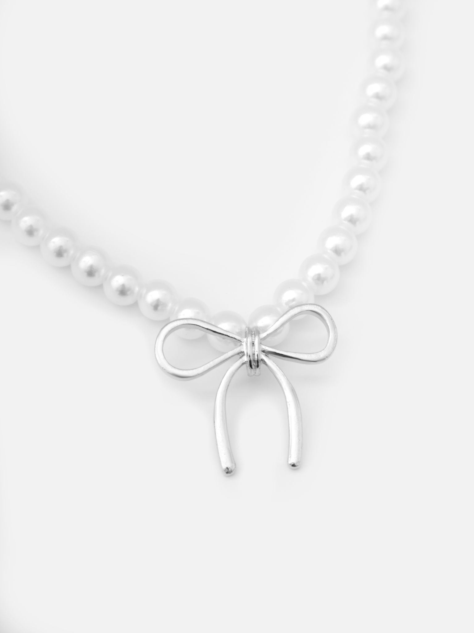 Жемчужное колье с подвеской-бантом