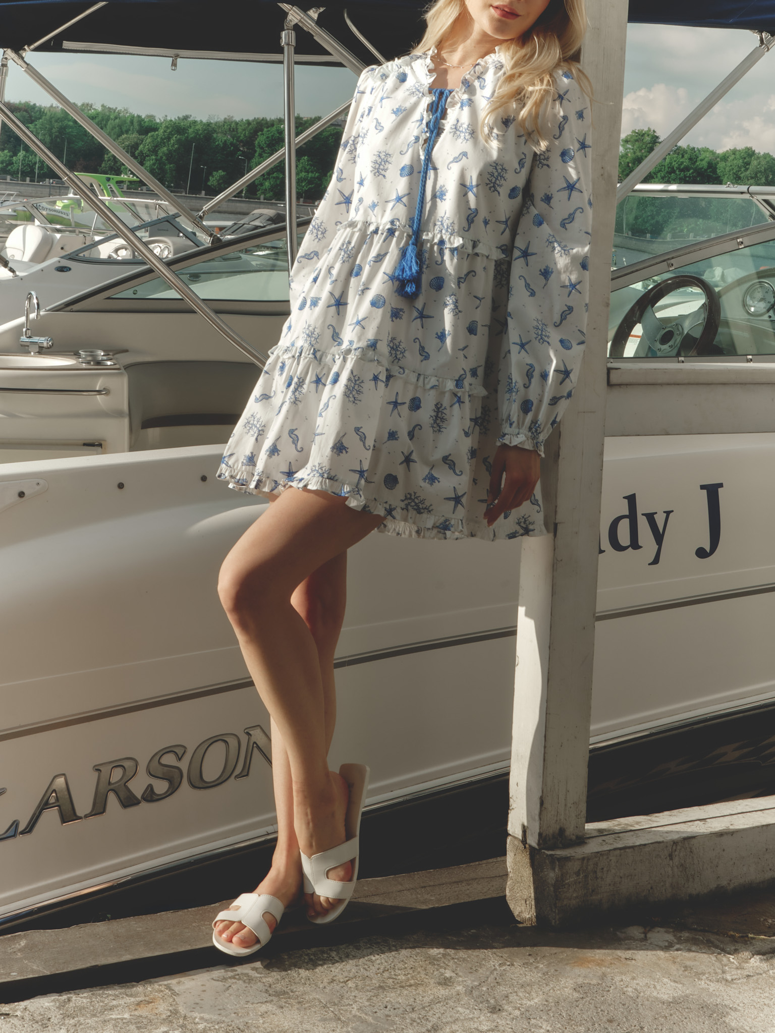 Layered mini dress with vibrant ties at the collar