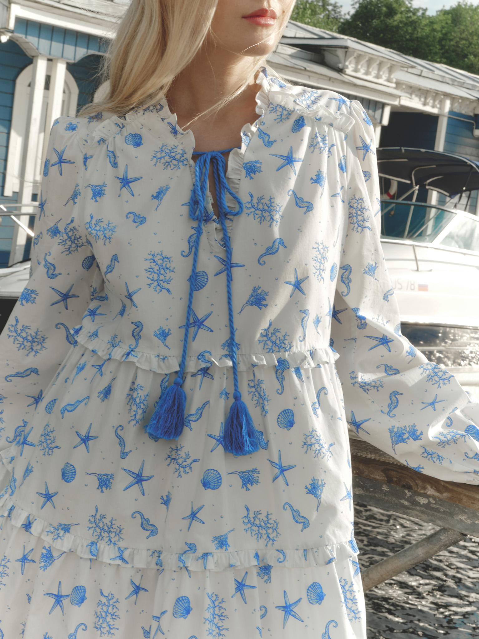 Layered mini dress with vibrant ties at the collar