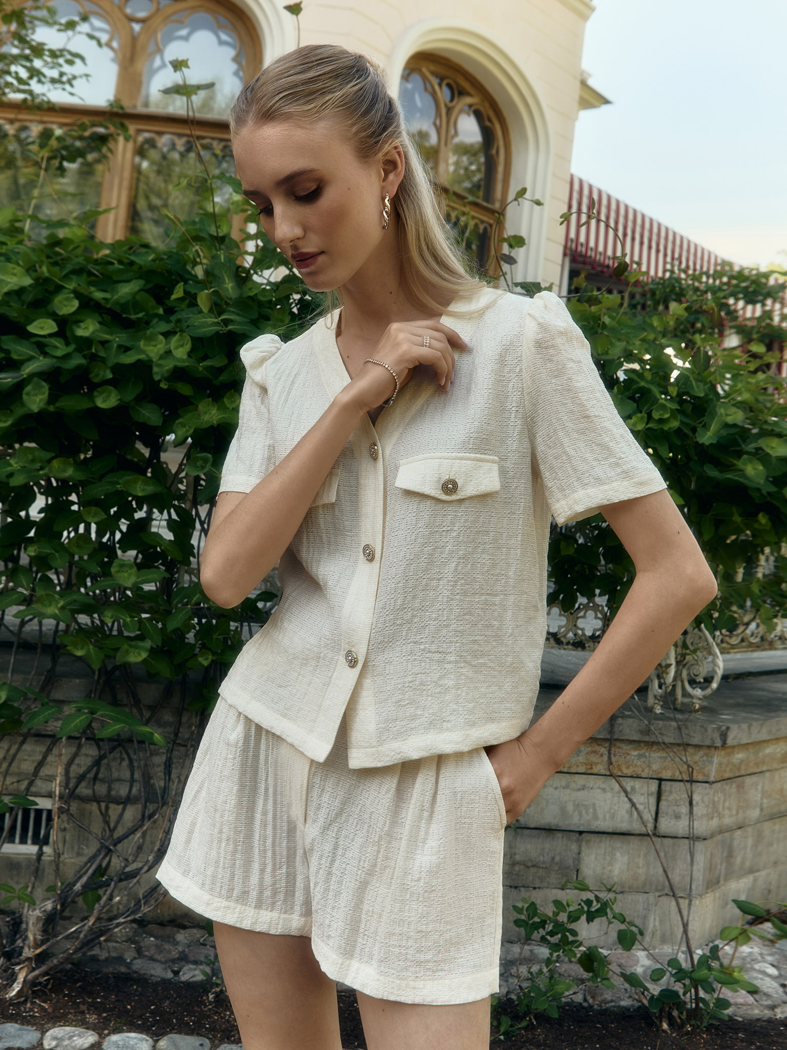 Mini shorts in textured fabric with waist pleats