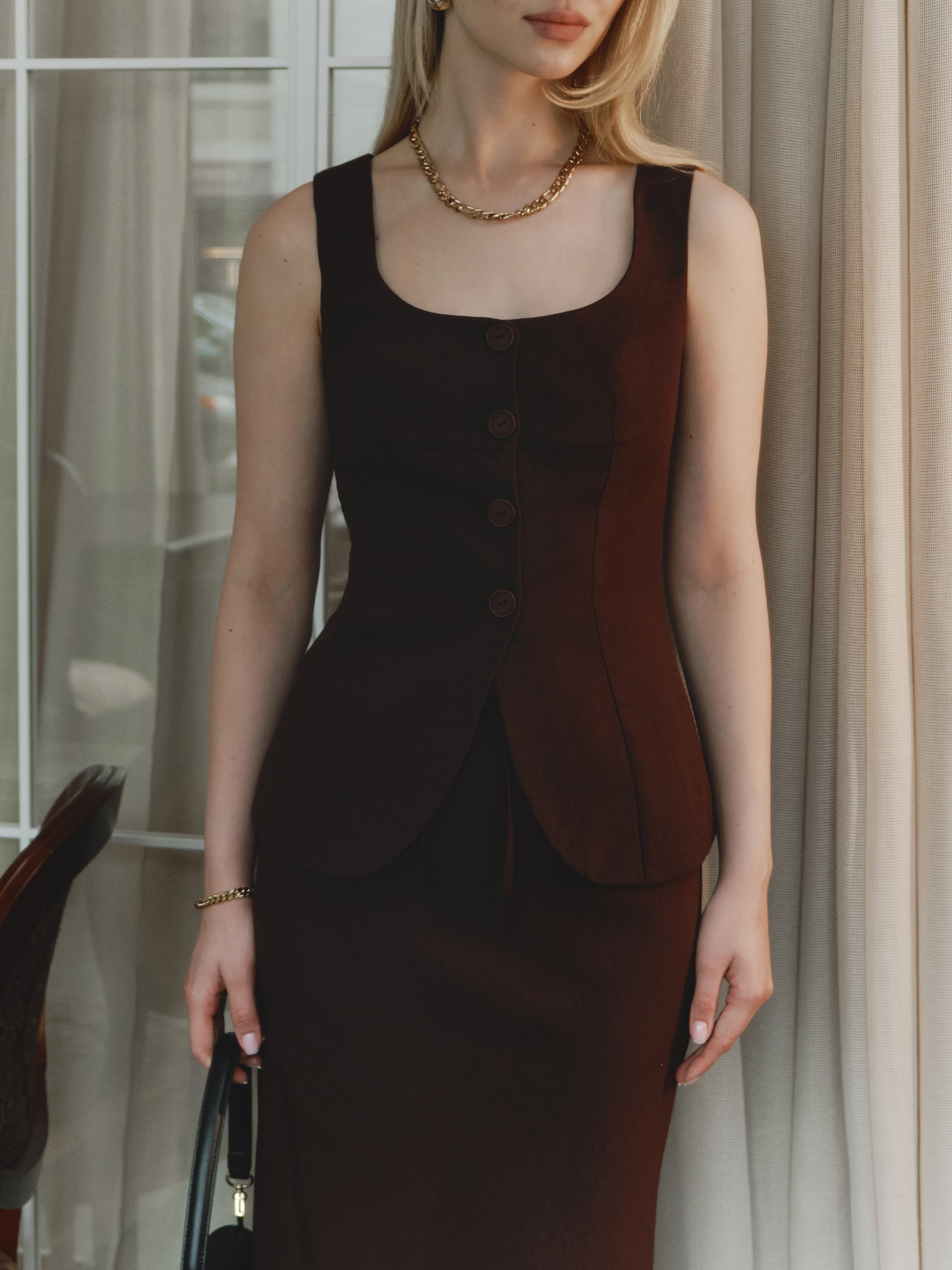 Waistcoat with round neckline and matching buttons