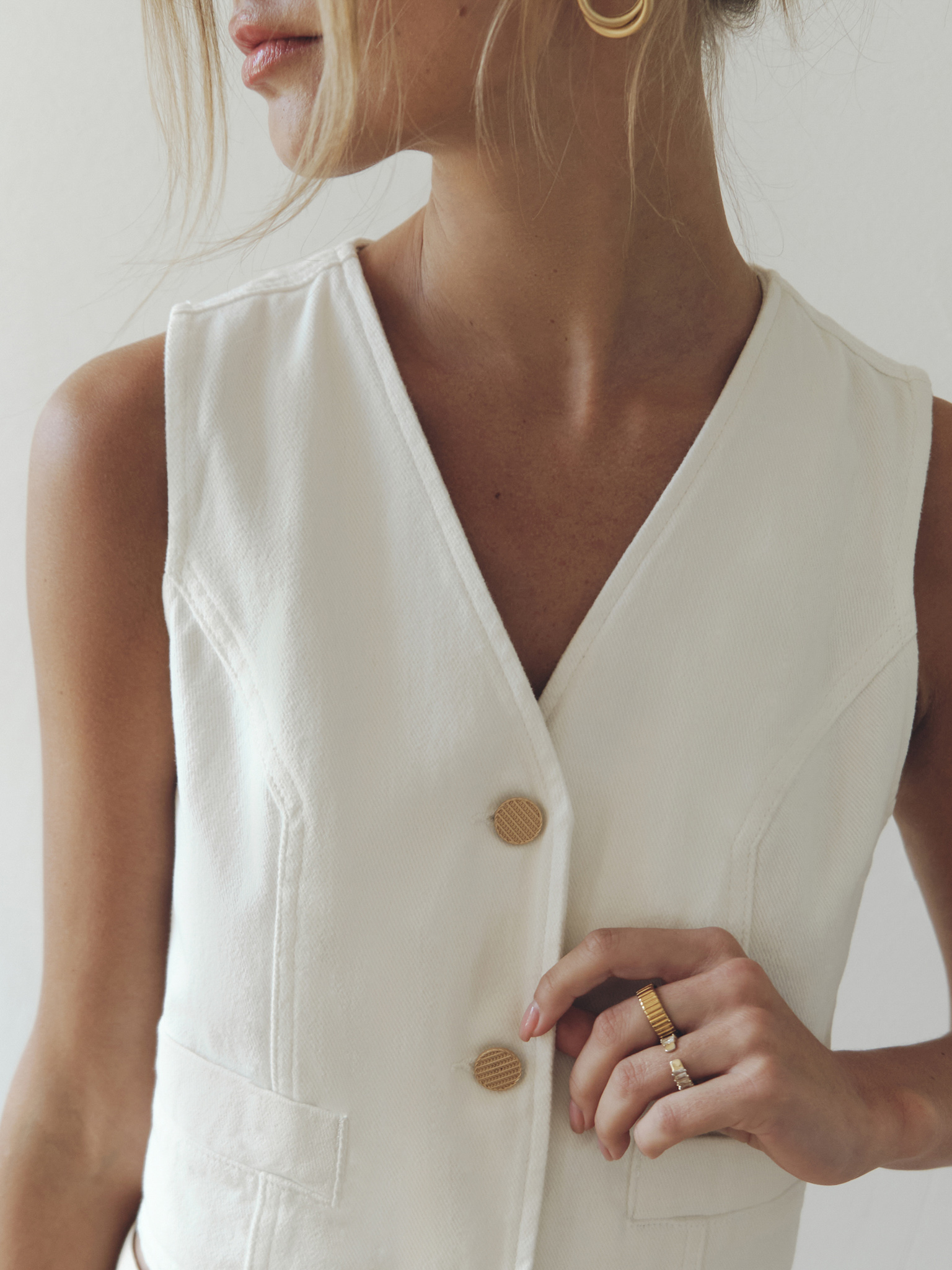 Denim waistcoat with golden buttons