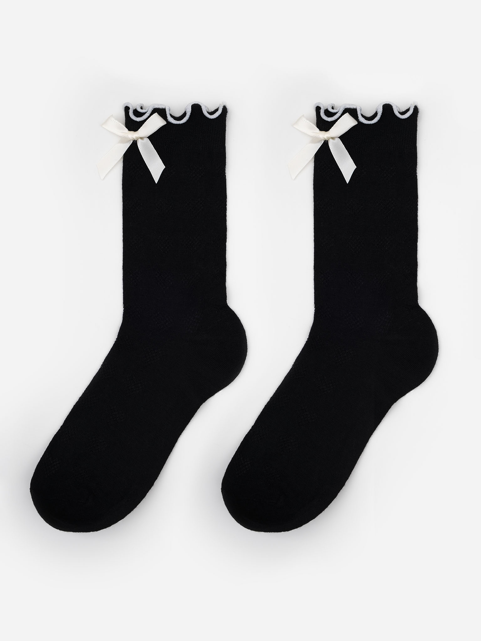 Set of two pairs of socks with ornaments and contrasting bows
