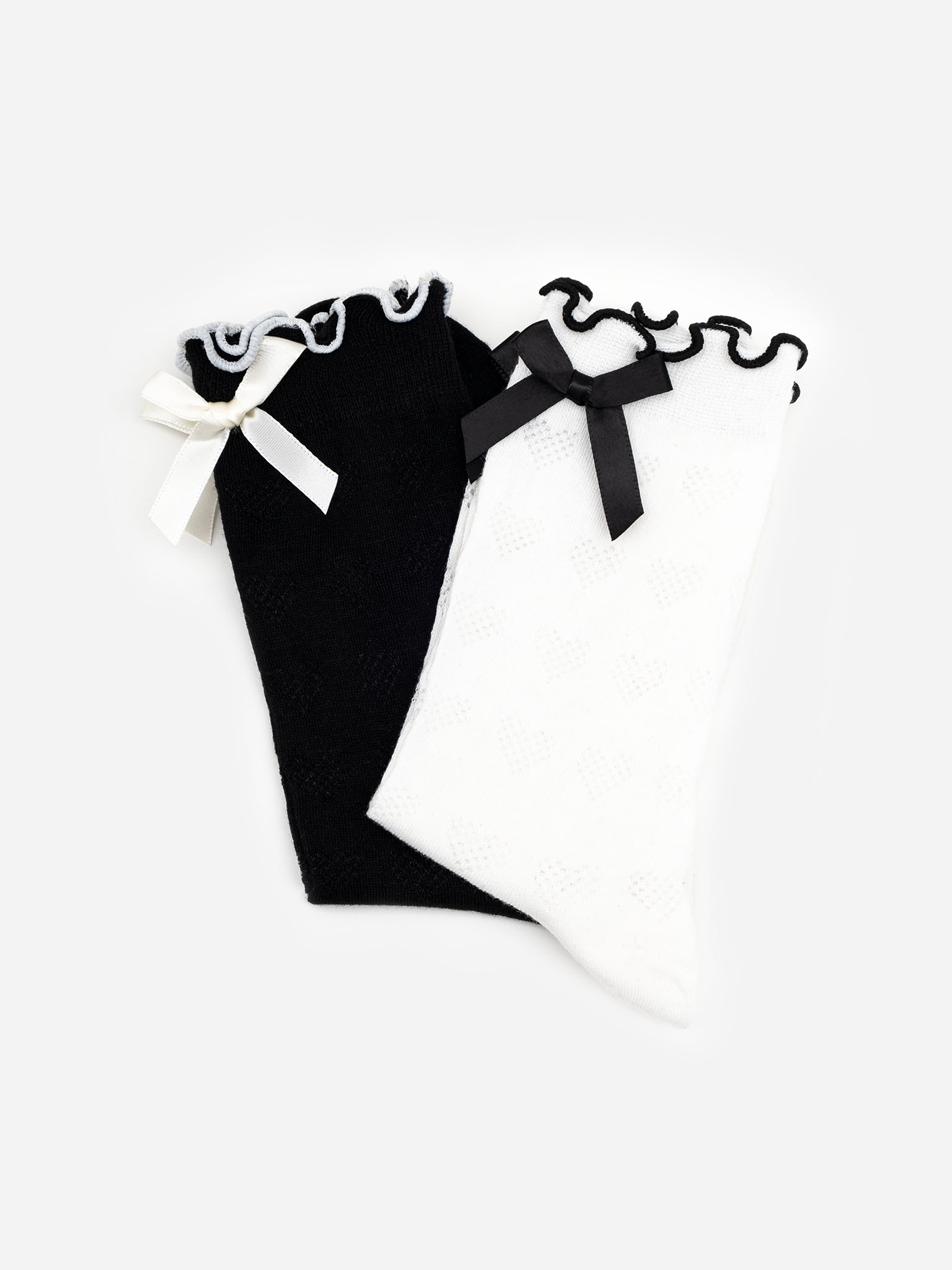 Set of two pairs of socks with ornaments and contrasting bows