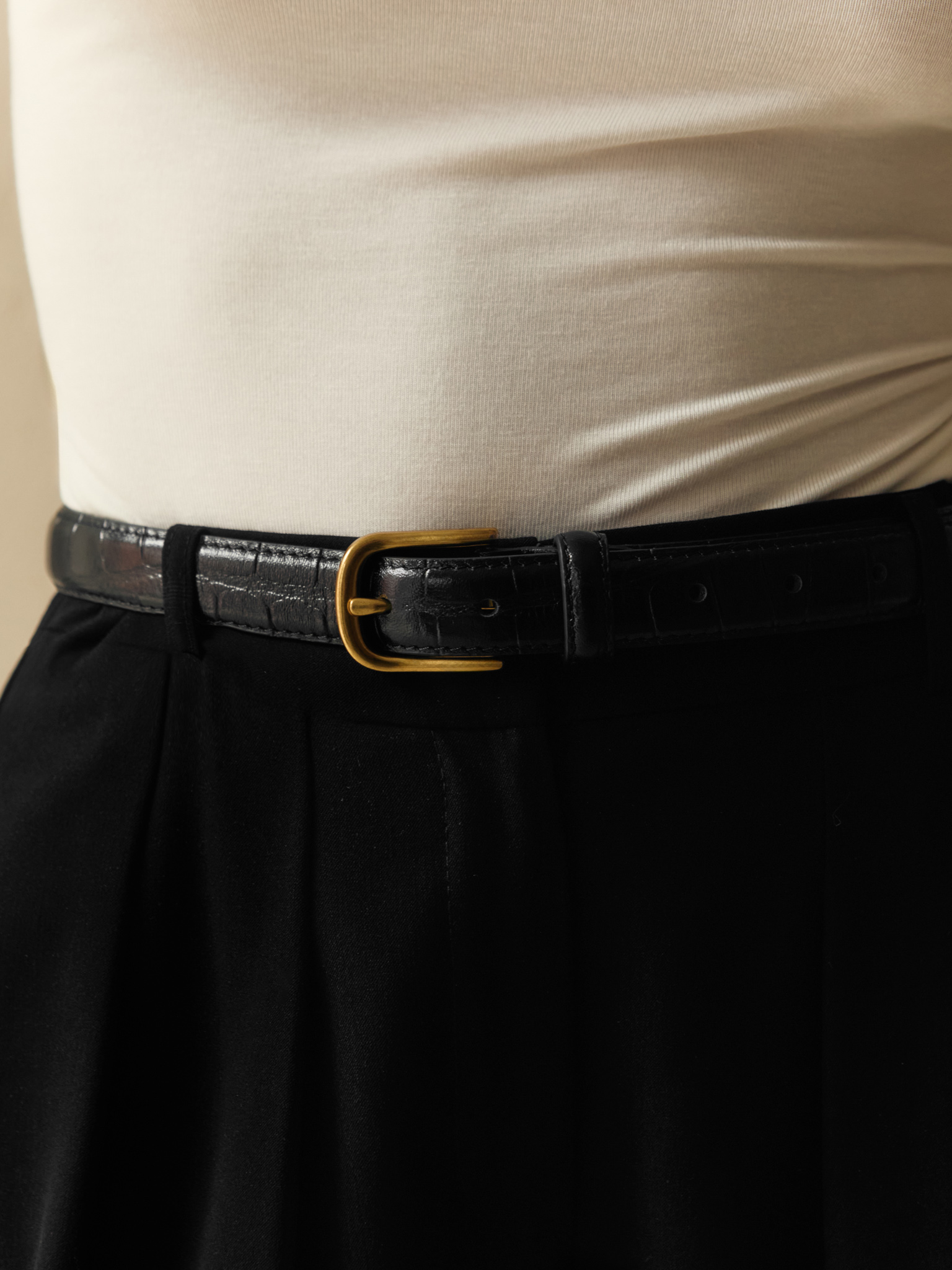 Textured leather belt with metal buckle