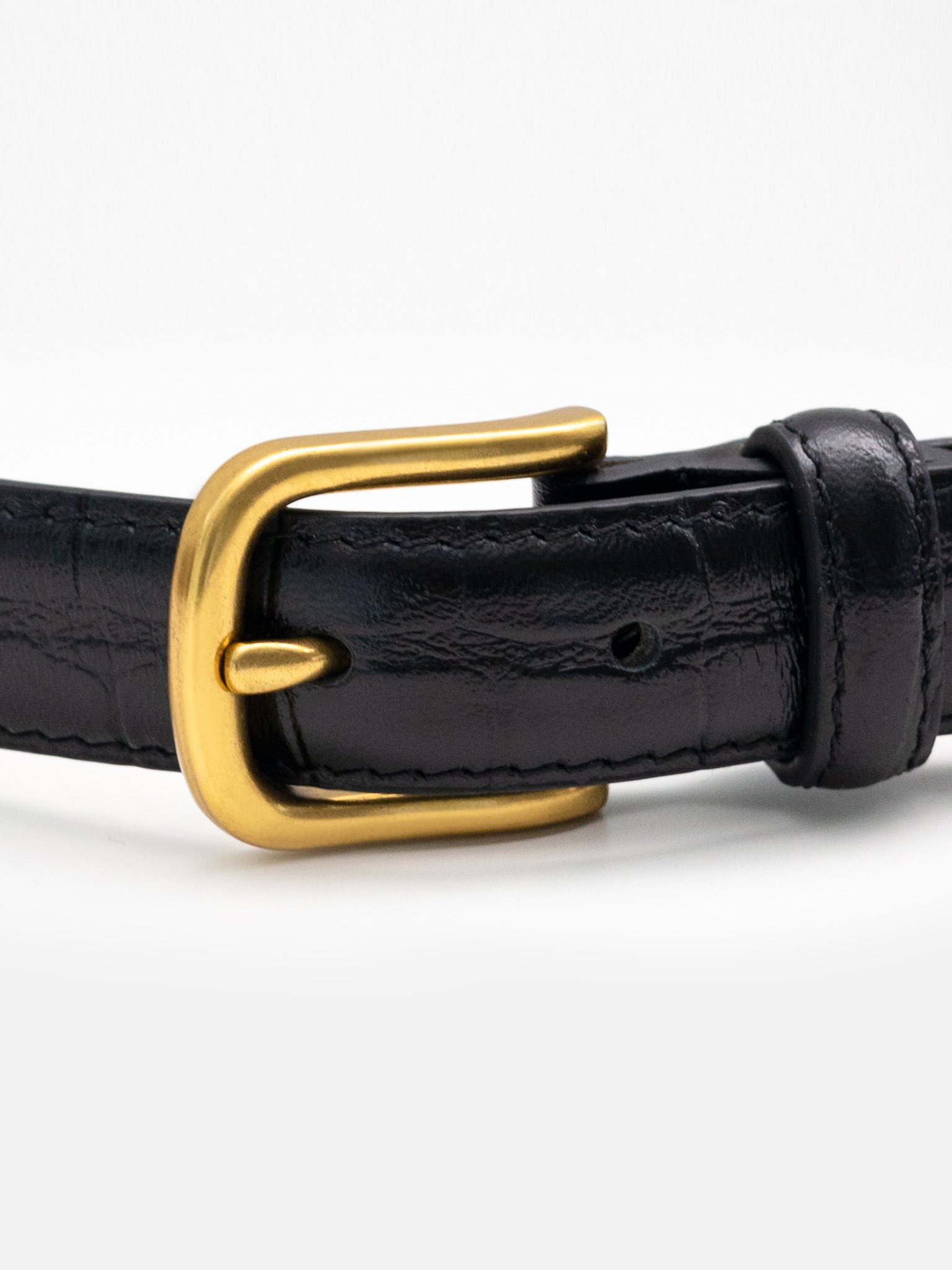 Textured leather belt with metal buckle