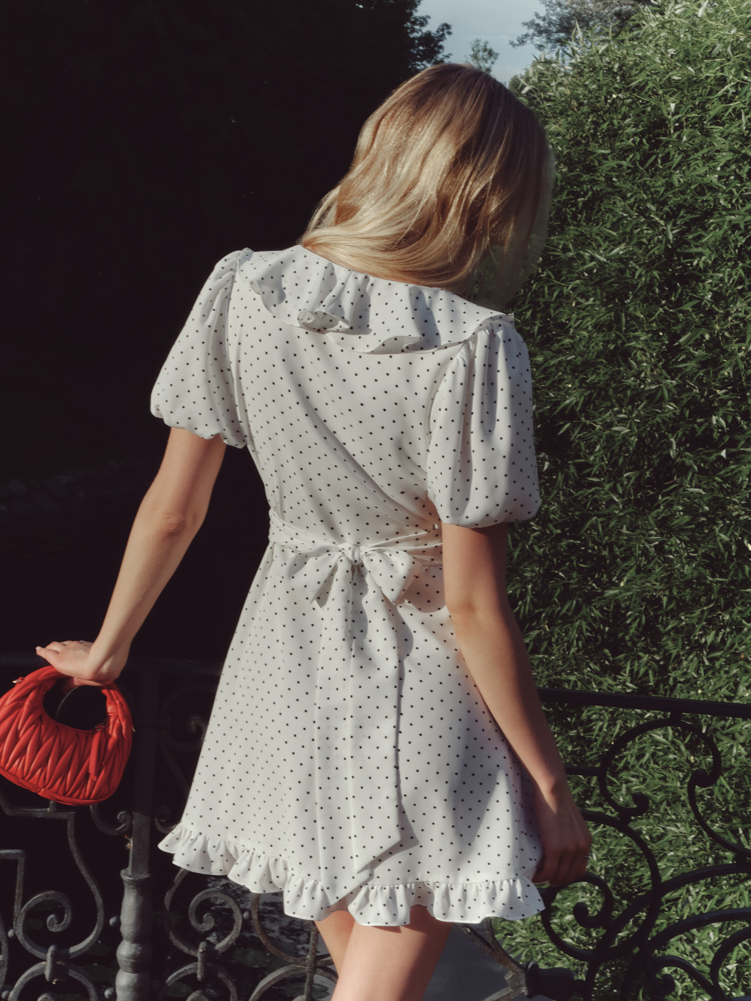 Mini polka-dot dress with contrasting flower