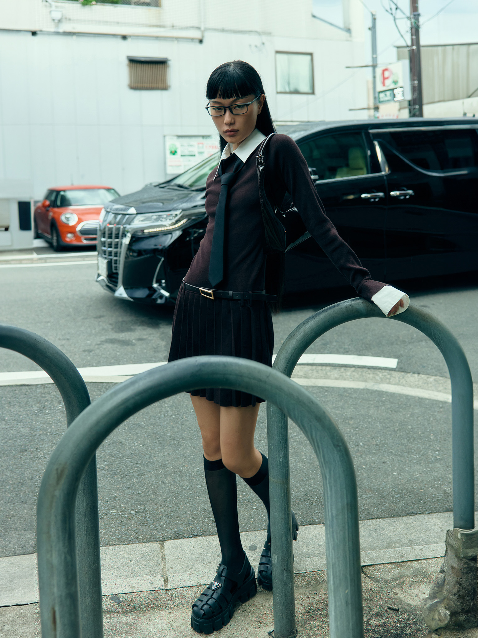 Mini knitted dress with contrast inserts and eco leather belt