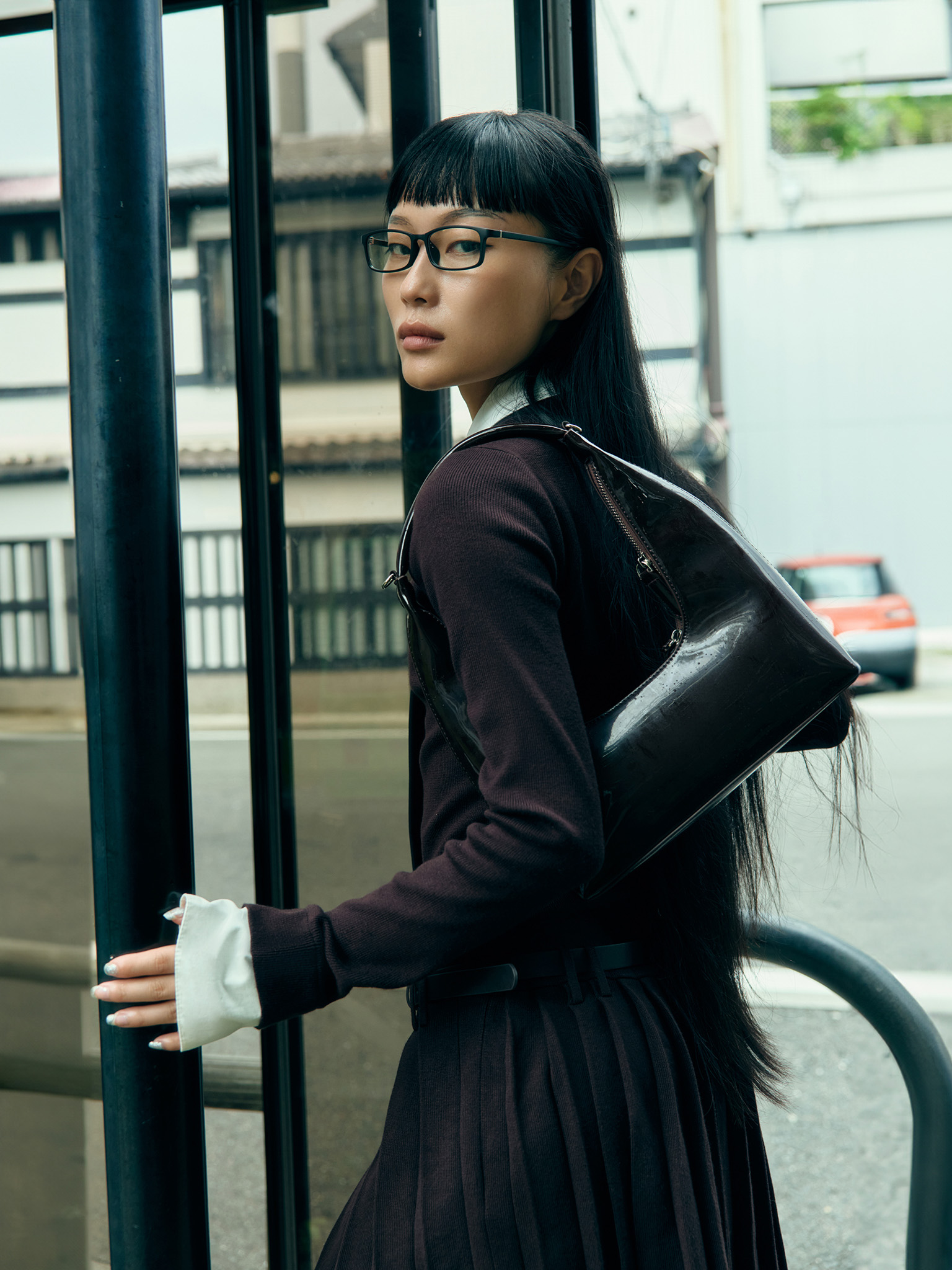 Mini knitted dress with contrast inserts and eco leather belt