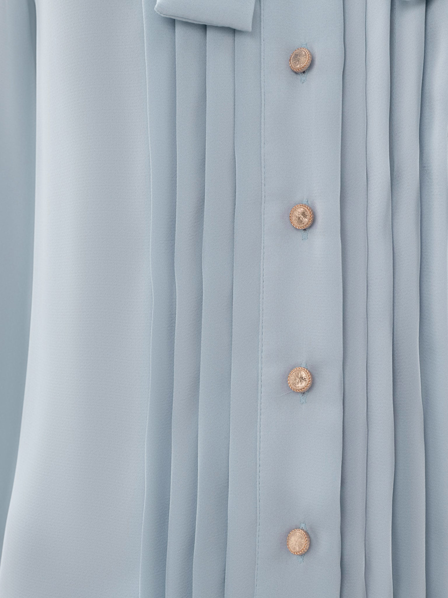 Loose blouse with a bow on the collar