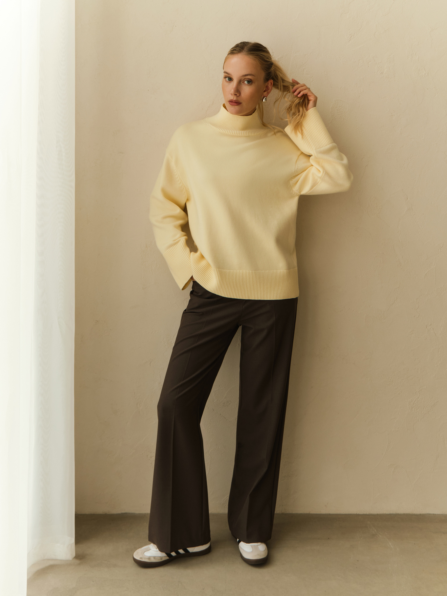 Straight suiting trousers with stitched creases and a belt