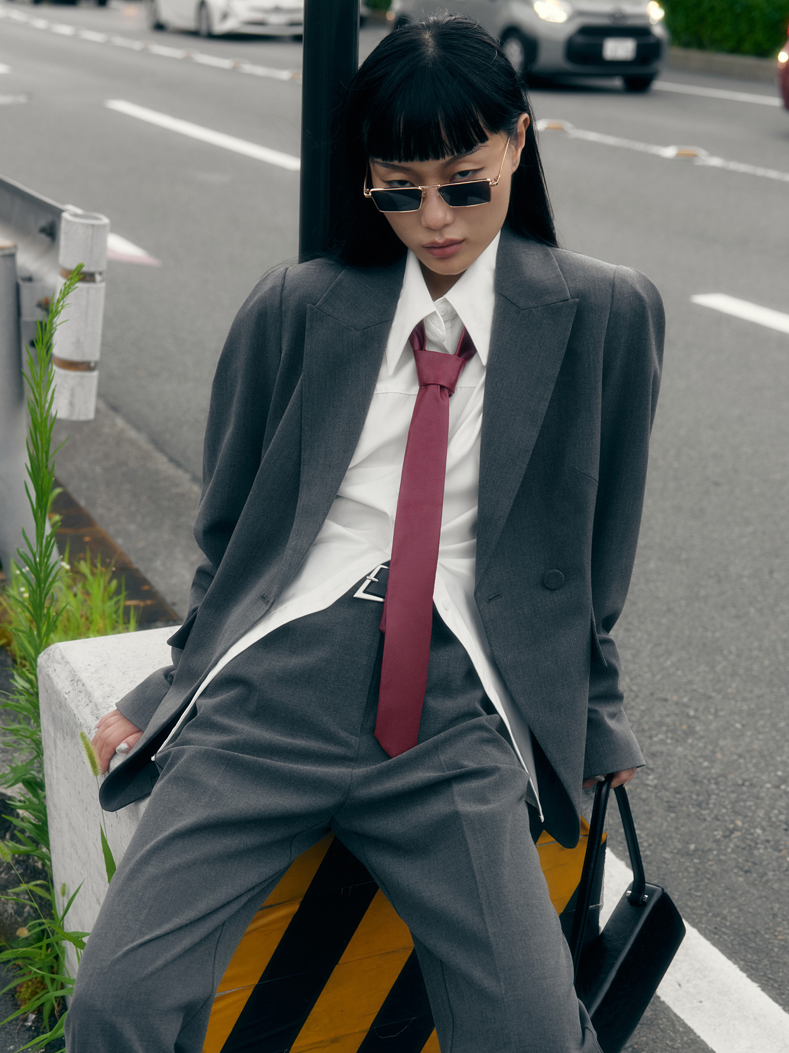 Straight suiting trousers with stitched creases and a belt