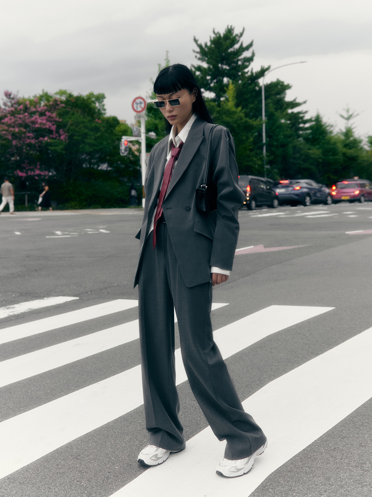 Straight suiting trousers with stitched creases and a belt