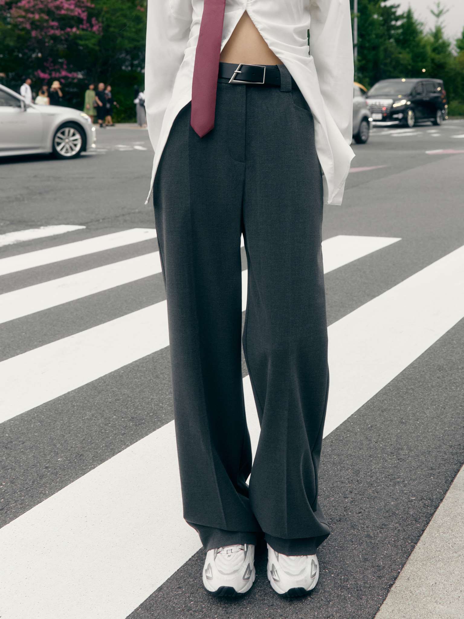 Straight suiting trousers with stitched creases and a belt