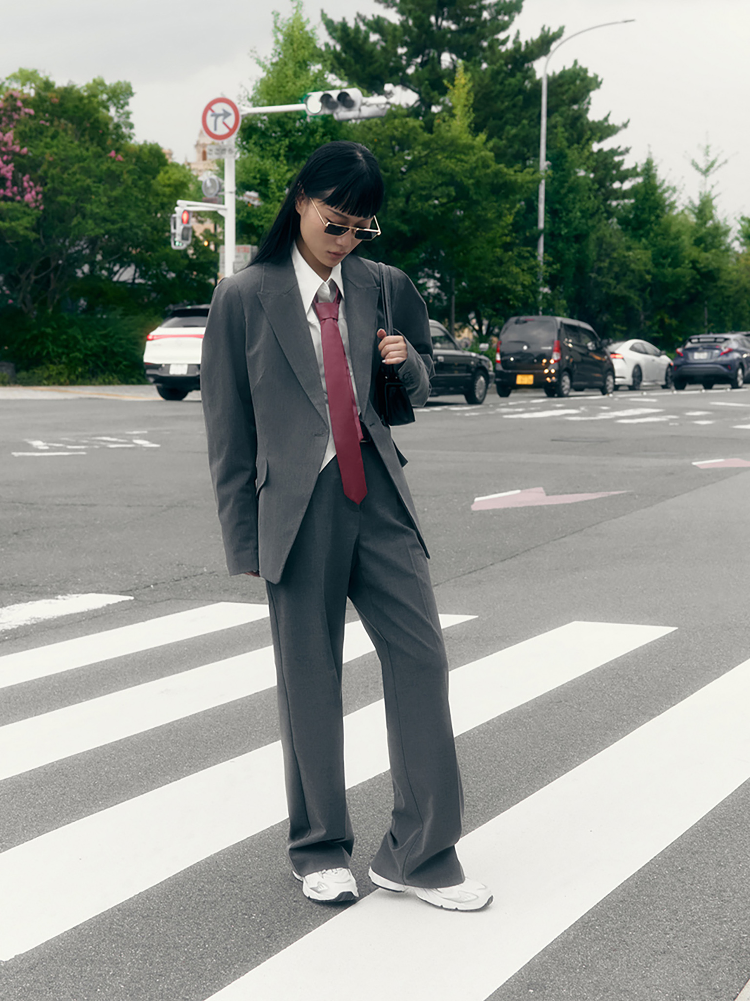 Straight suiting trousers with stitched creases and a belt