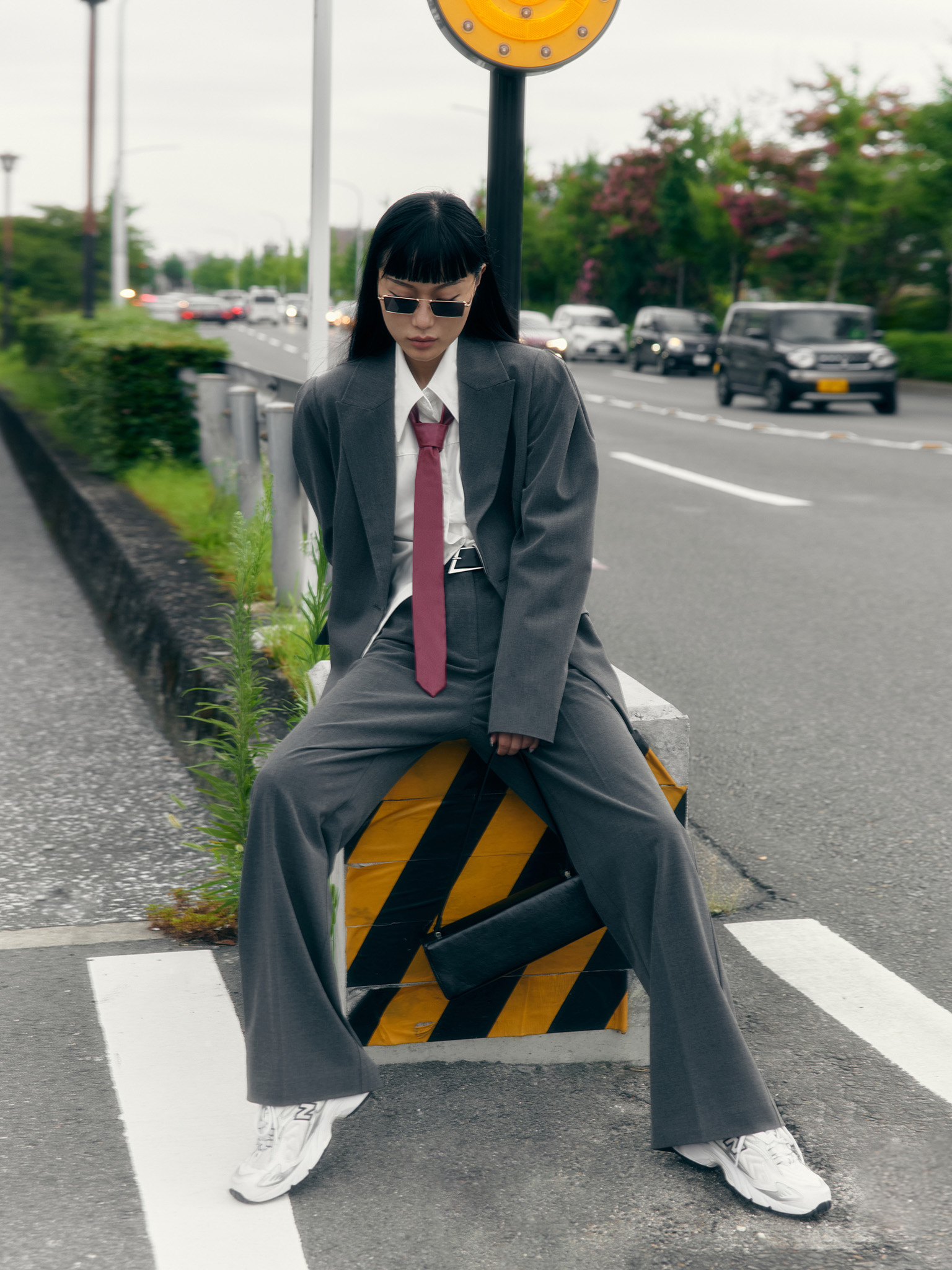 Straight suiting trousers with stitched creases and a belt