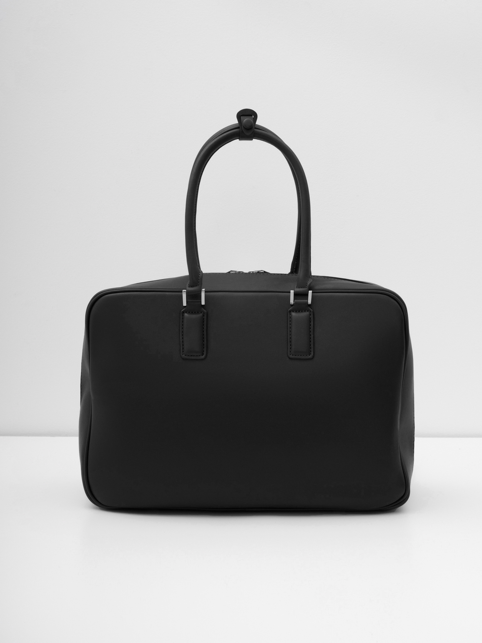 Rectangular eco-leather bag with short handles