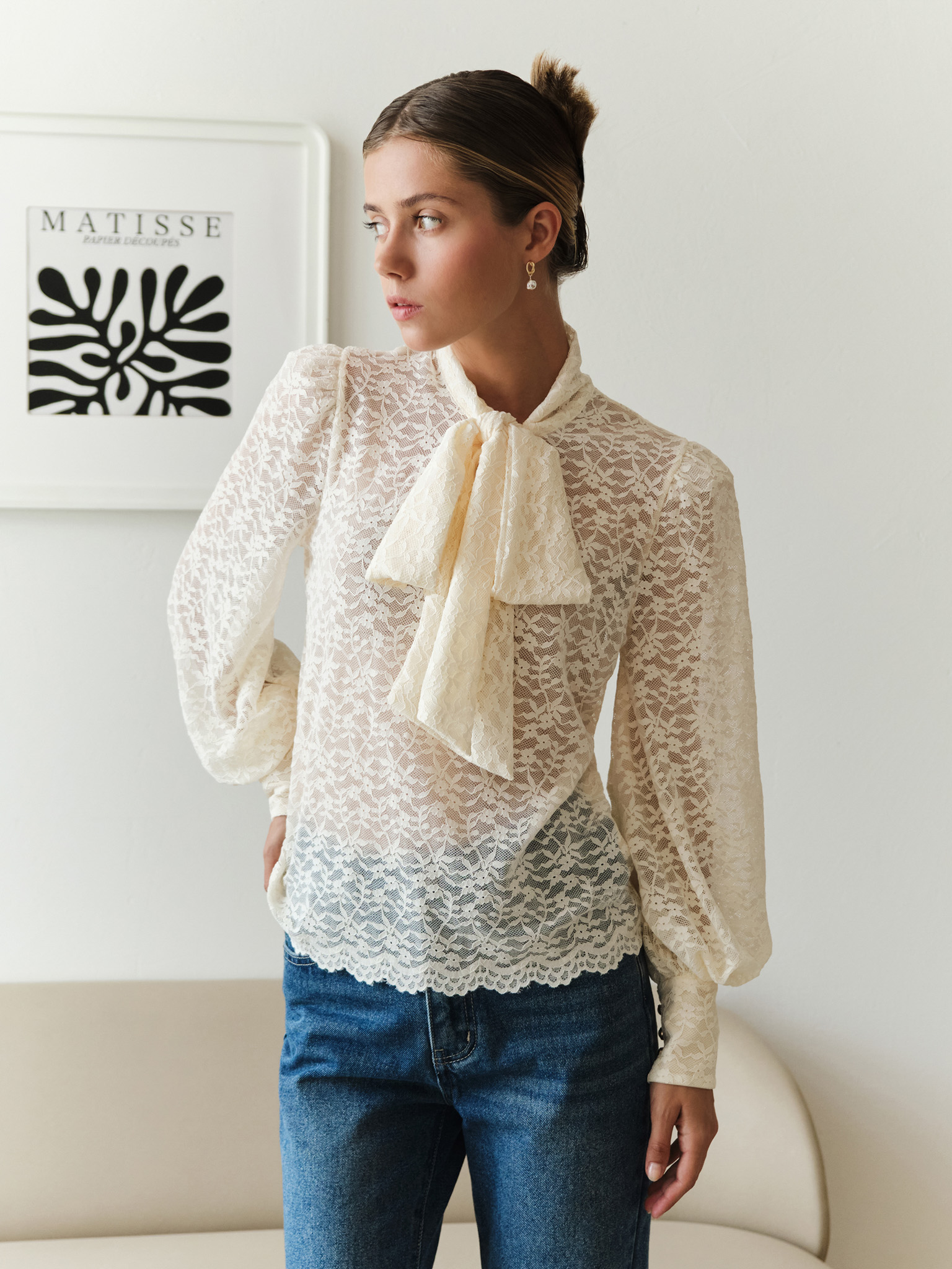 Lace blouse with a bow on the collar