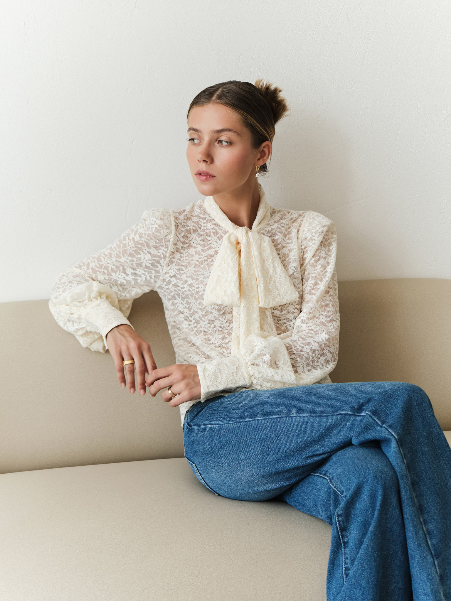 Lace blouse with a bow on the collar