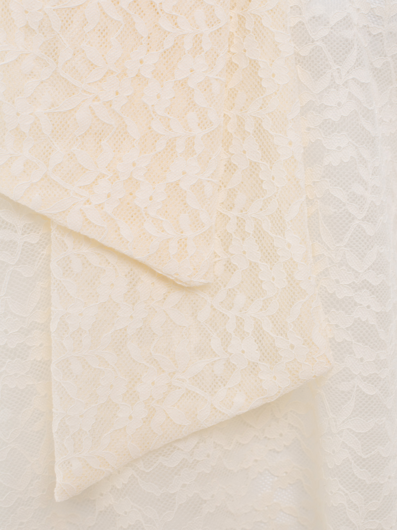 Lace blouse with a bow on the collar